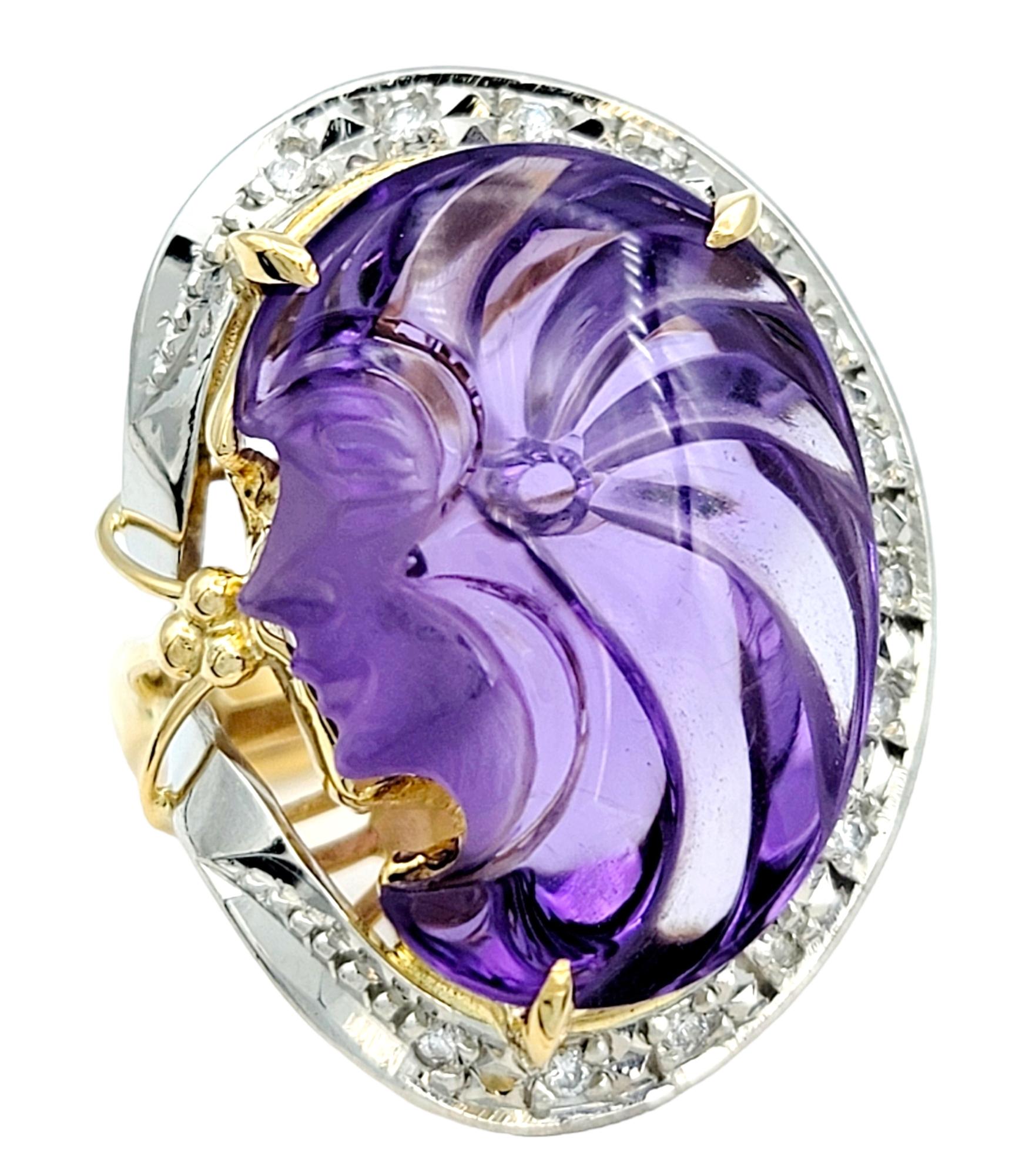 Ring size: 6

This wonderfully unique two-tone carved amethyst cameo ring is an absolute treasure. This piece is a true work of art in both design and craftsmanship, blending timeless beauty with modern luxury.

The centerpiece of this ring is a