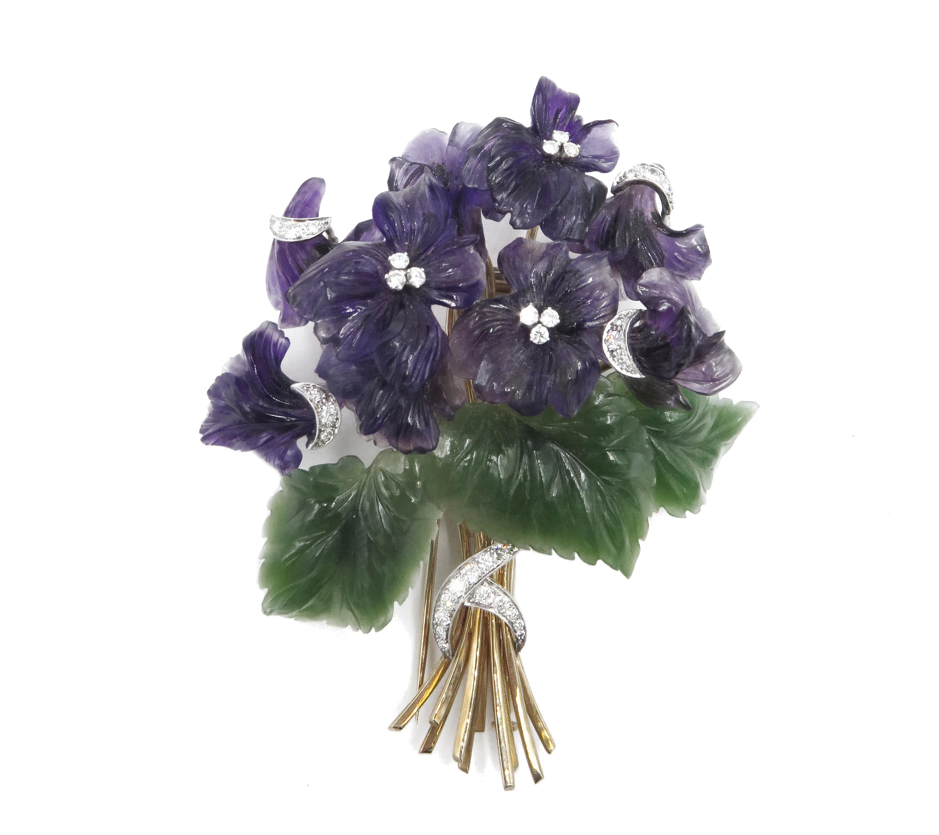 An Elegant set of bouquets comprised of carved Amethyst violet flowers accented with diamonds. Set in white gold, arranged with beautifully carved Nephrite leaves supported on yellow gold stems all tied together with a sparkling diamond ribbon. What