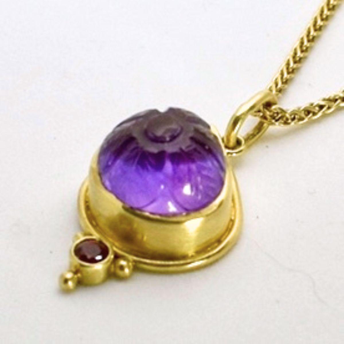 Hand fabricated by Lynn Kathyrn Miller of Lynn K Designs, this timeless one of a kind pendant harkens back to the Byzantine era. 

This unique hand fabricated pendant consists of a prominently displayed hand carved royal purple amethyst and a