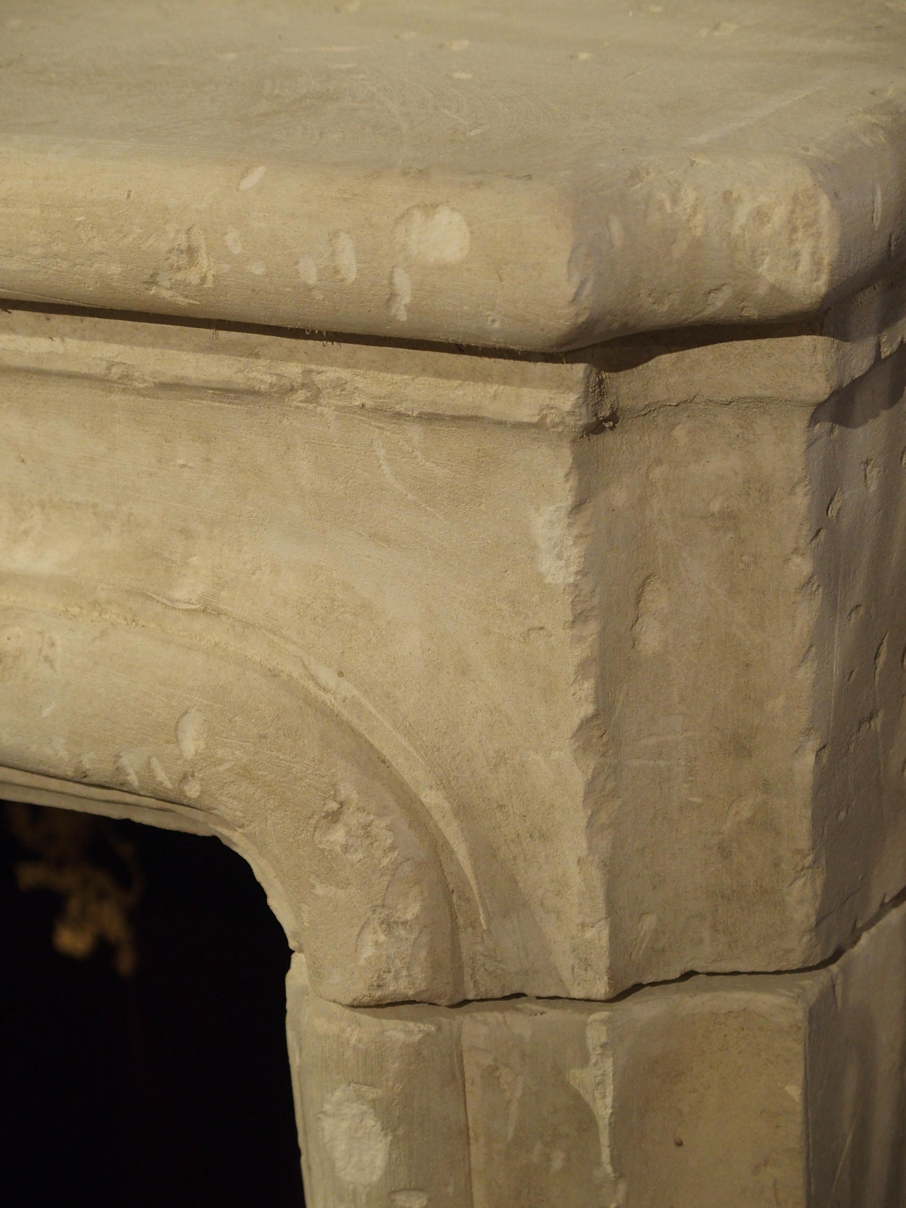 Carved and Distressed Italian Limestone Fireplace Mantel In Excellent Condition In Dallas, TX