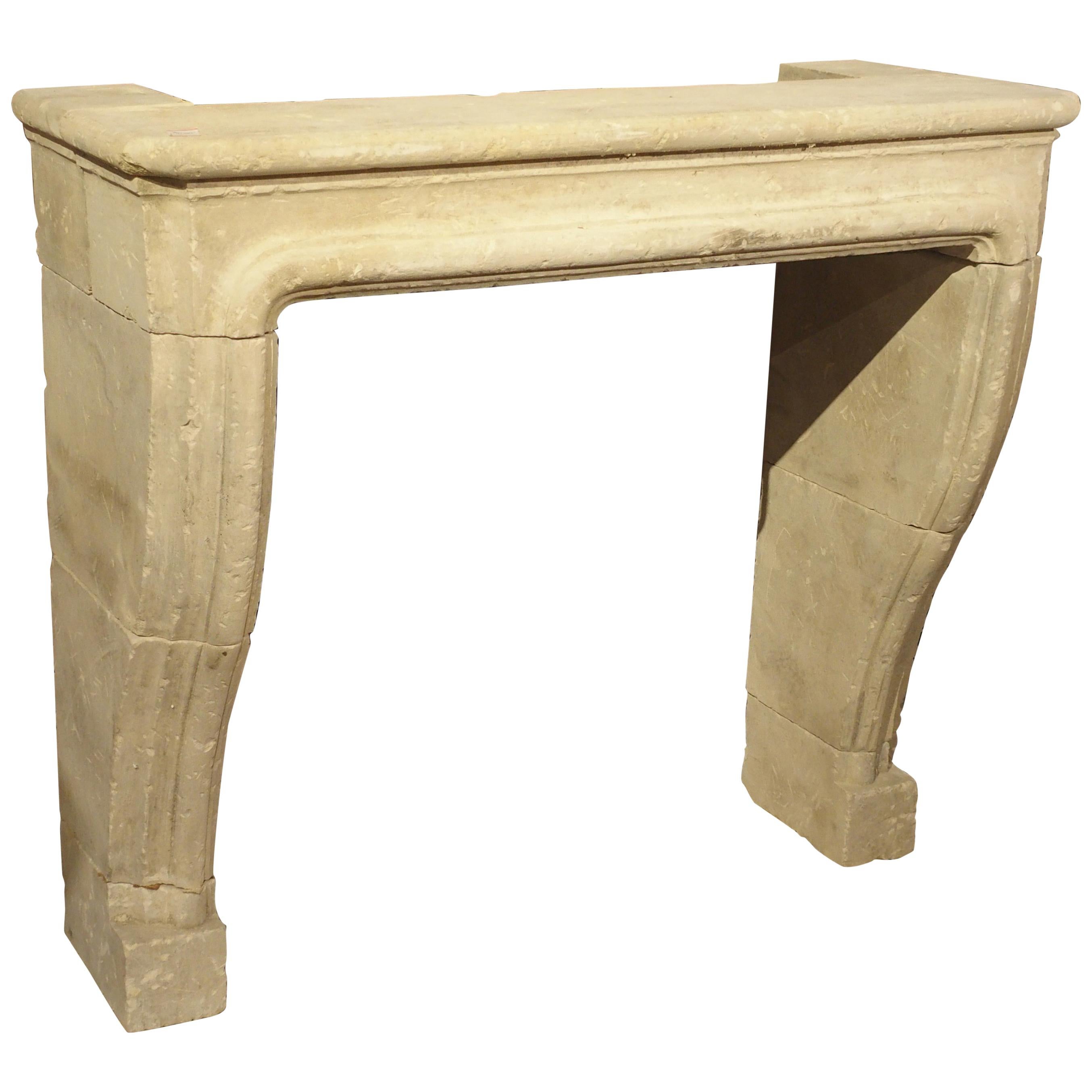 Carved and Distressed Italian Limestone Fireplace Mantel