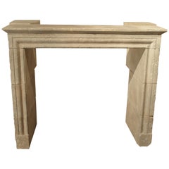 Carved and Distressed Italian Limestone Fireplace Mantel