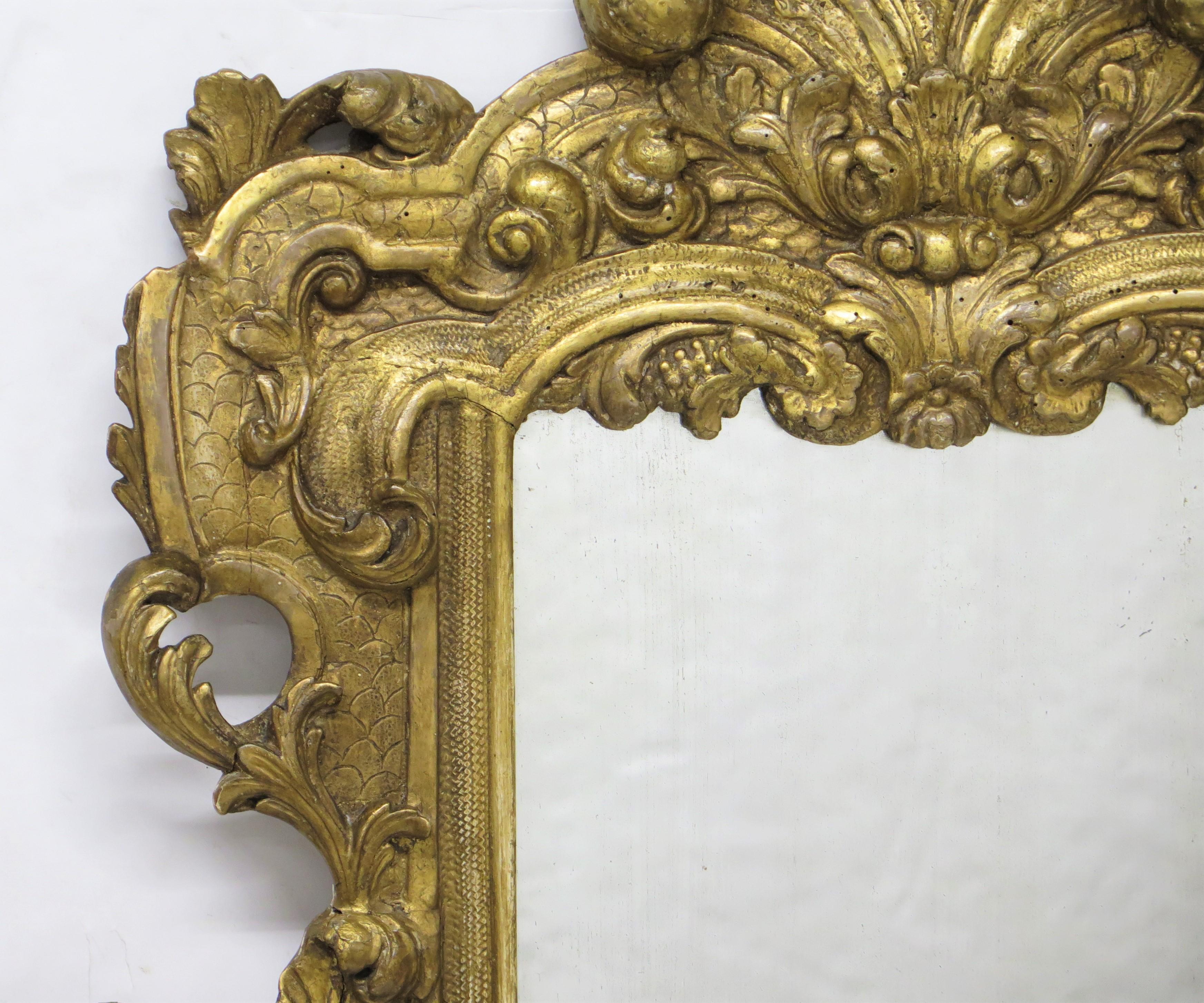Hand-Carved Carved and Gilded Italian Looking Glass / Mirror For Sale