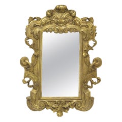 Miroir italien sculpté et doré
