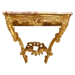 Console en bois sculpté et doré, dessus en marbre, 18e siècle.