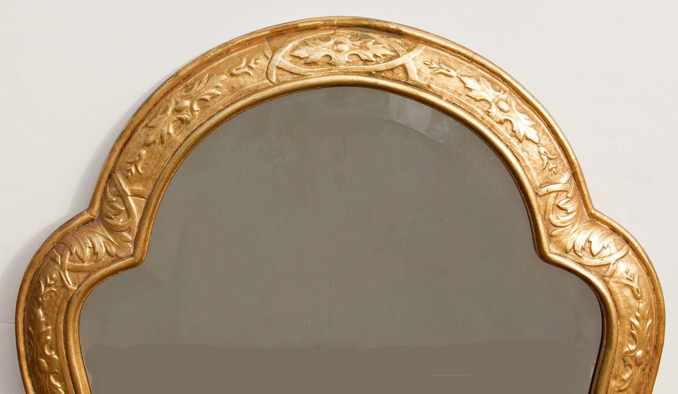 Carved and gilt beveled glass mirror. In the Moresque style. Please, contact us for shipping options.
 