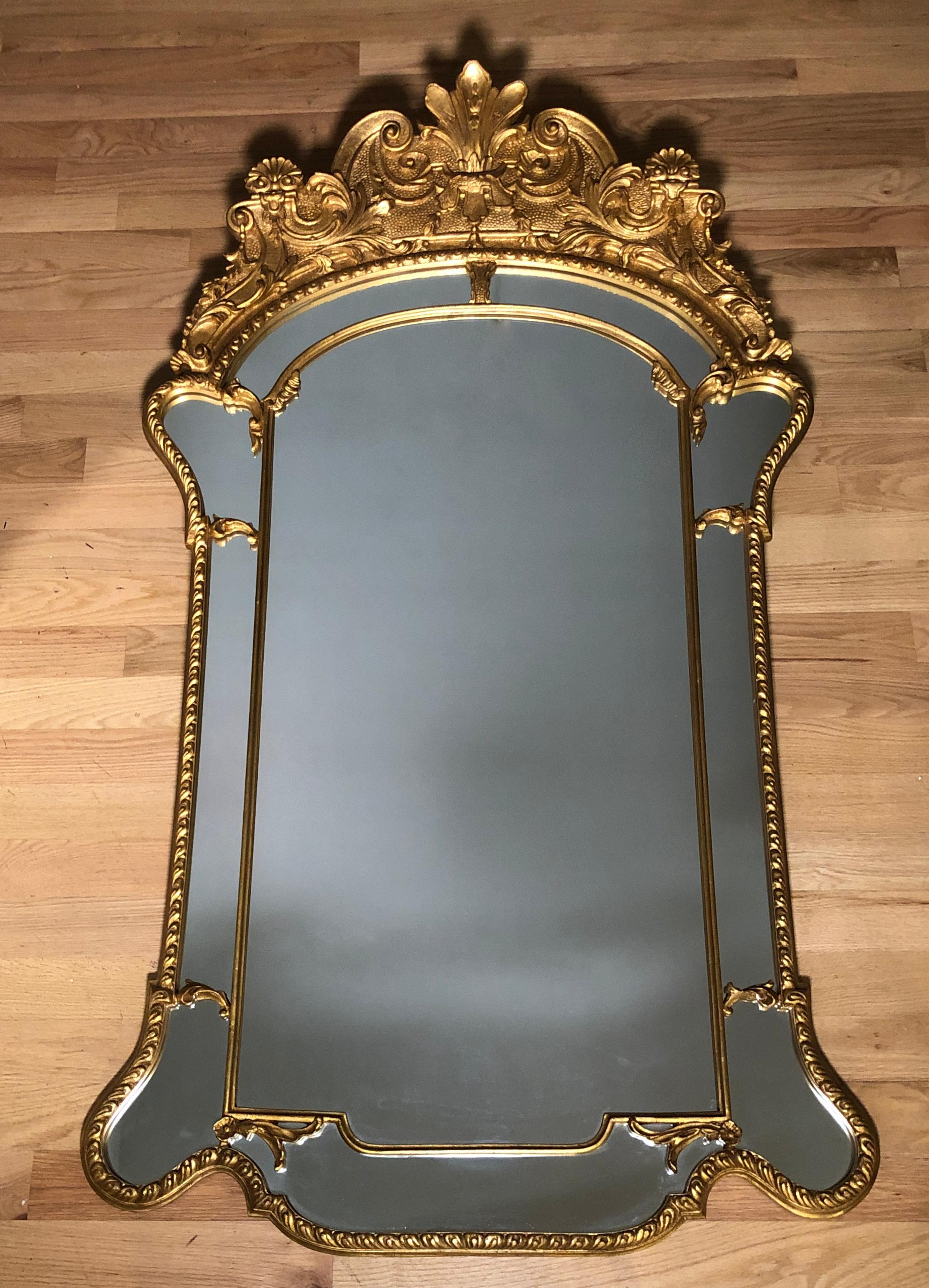 Fine quality large carved and gilt Regency mirror. Beautiful gilding with a Versailles form interior frame.