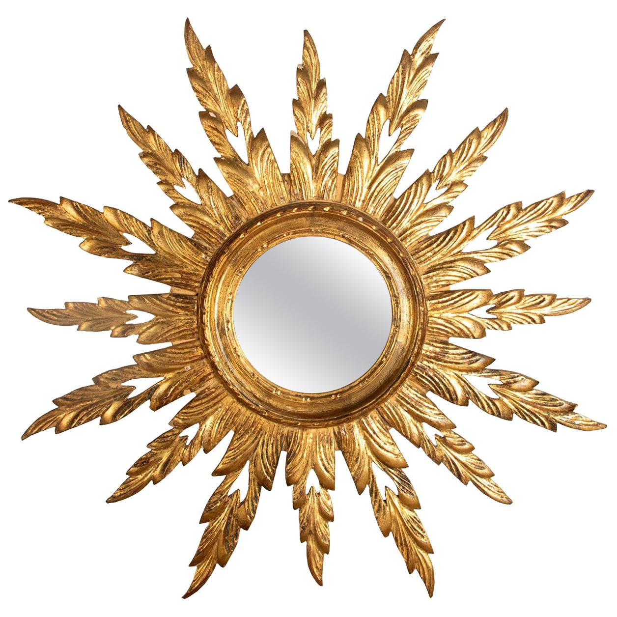 Carved and Gilt Wooden Sunburst Mirror at 1stDibs