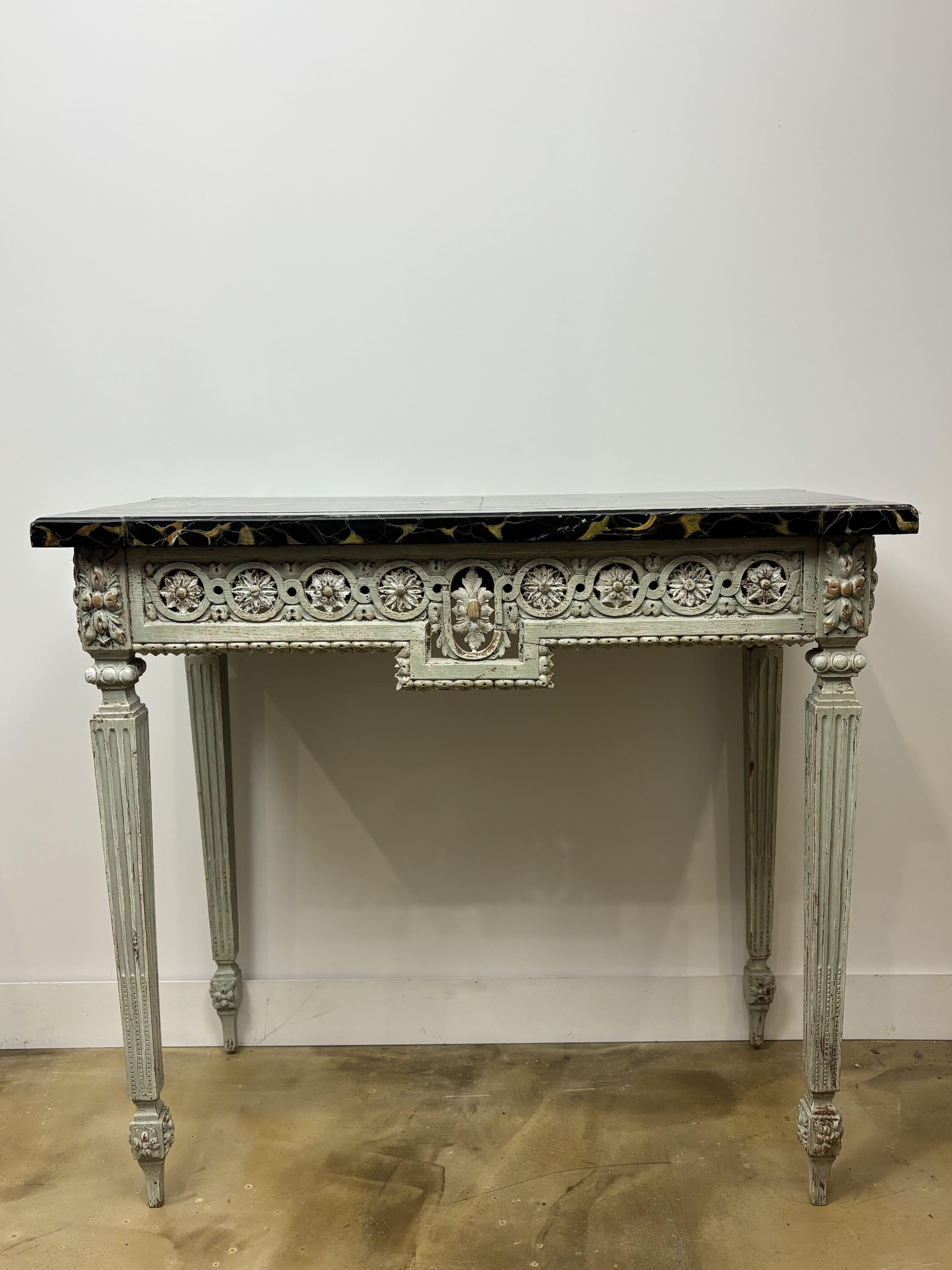 Carved And Lacquered Wooden Console, Early 19th Century Circa 1800-1820, France 

Elegant carved wooden console table with its old patina, typical of the Louis XVI style, early 19th century (circa 1800-1820).  

It rests on four tapered and fluted