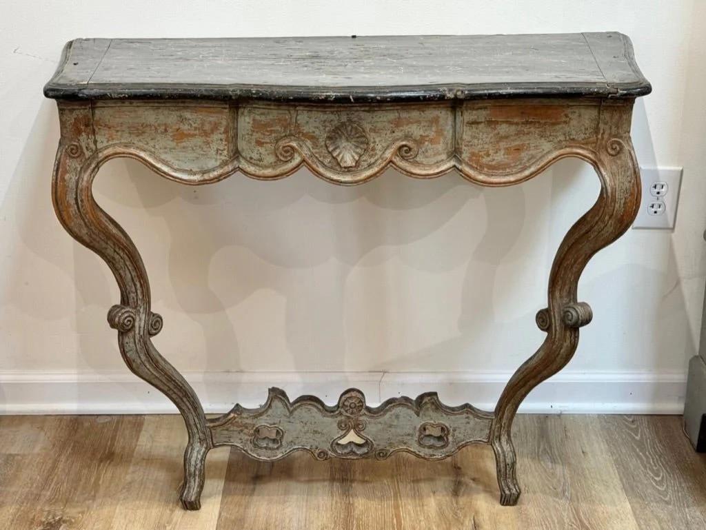 19th Century Continental polychrome pale green/blue carved console table, the top faux paint marble, with lovely rococo carving.  Likely French or Italian.

