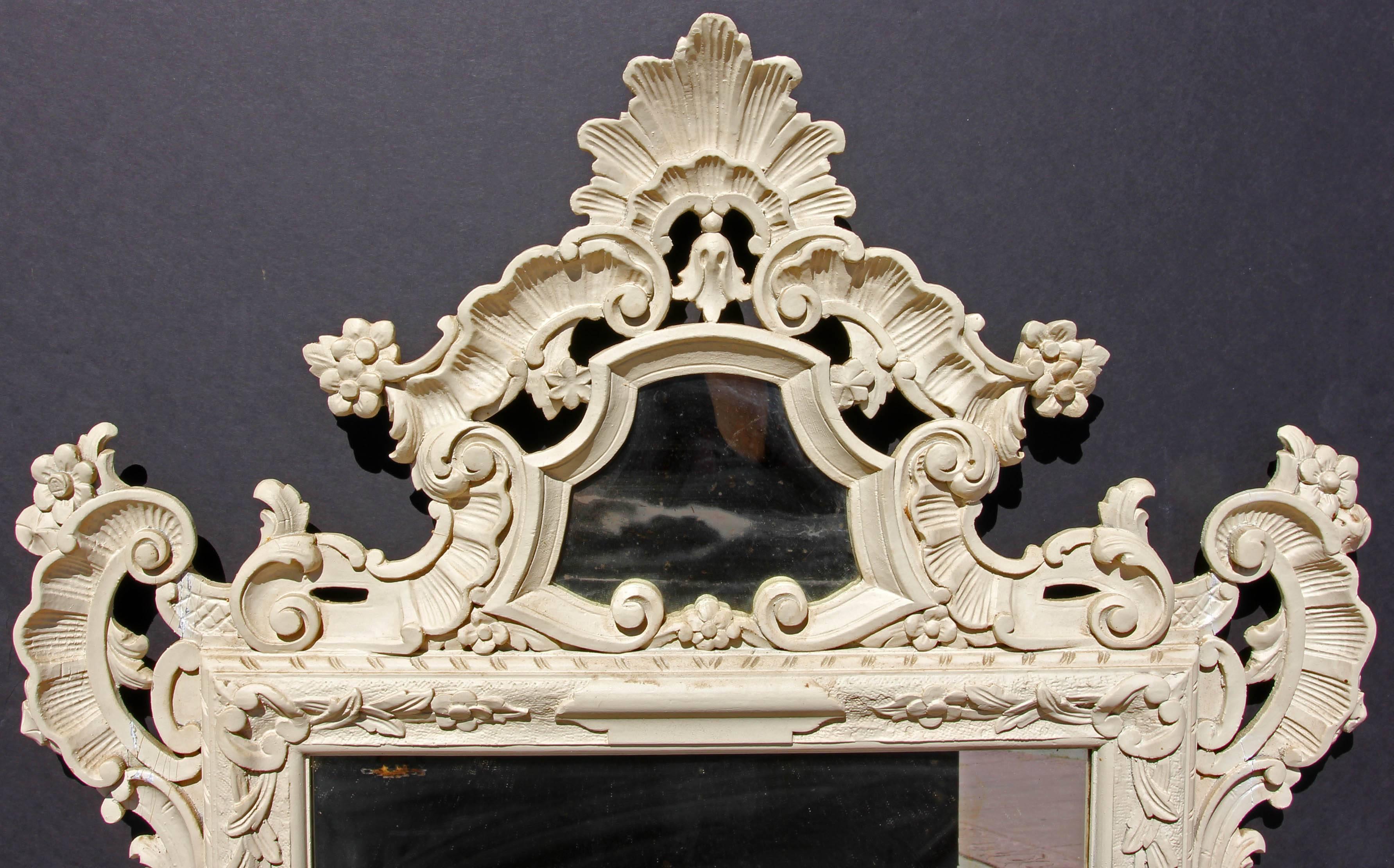 Carved and painted wood Louis XV style mirror. Made in Italy.