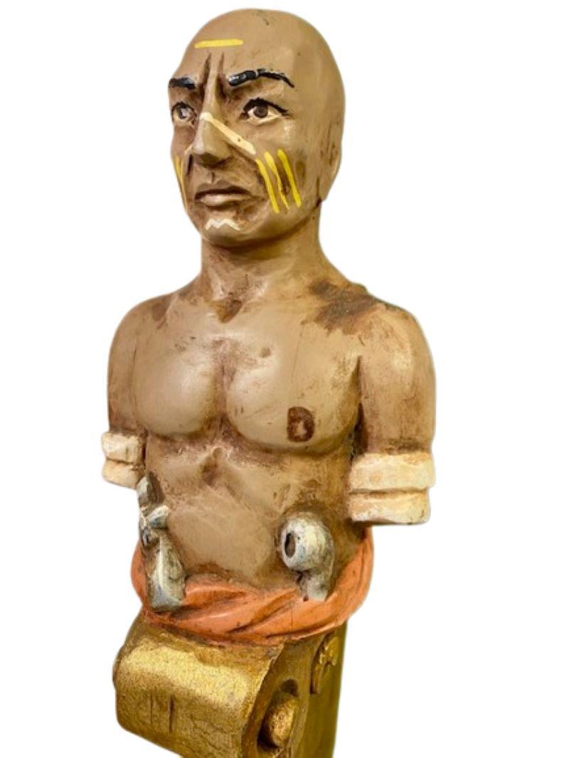 Vintage Carved and Painted Miniature Ship's Figurehead of the Pequot Harpooner Tashtego (from Moby Dick), by Willard Shepard (1912 - 1965), Waterford, Connecticut, circa 1950s, a half-length figure atop a scroll base in the manner of a ship's
