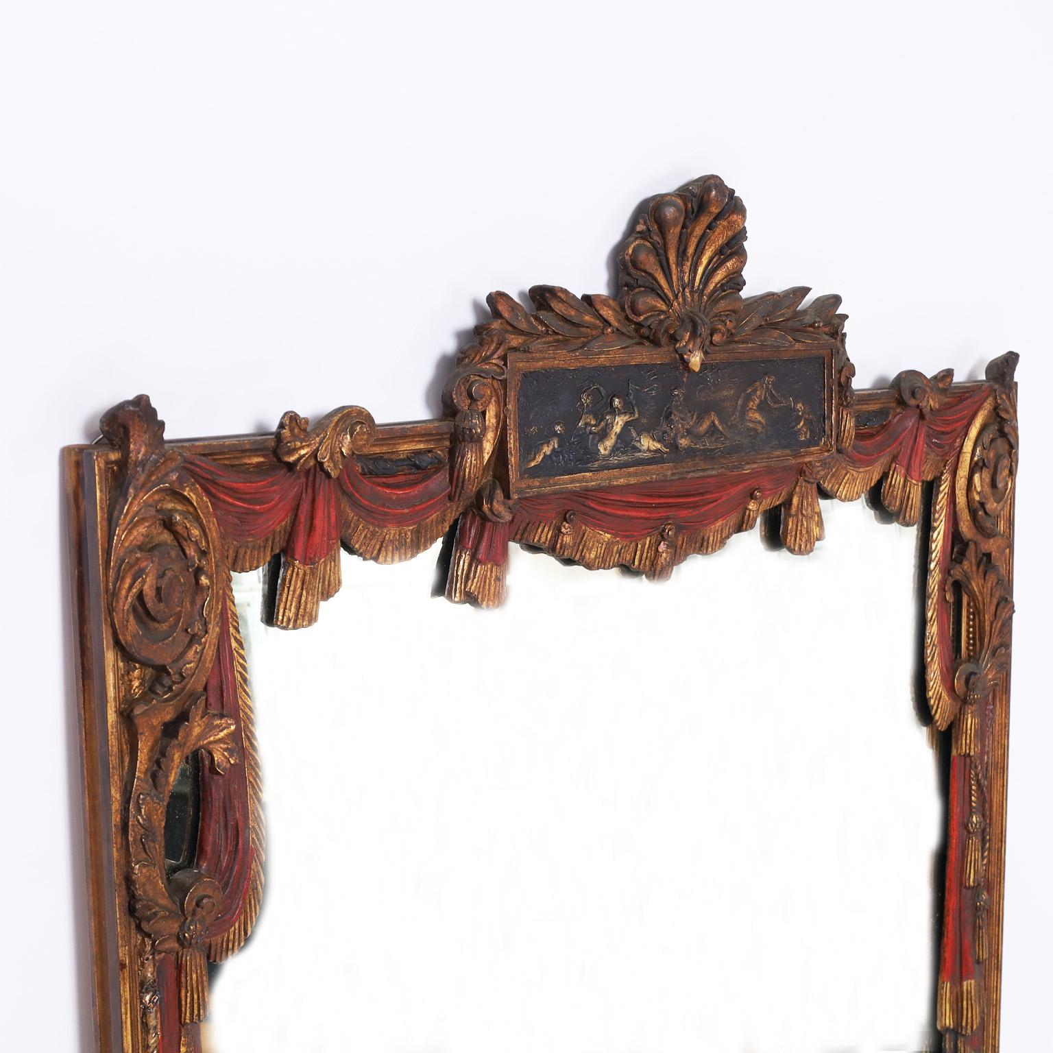 Dramatic antique wall mirror crafted in hardwood, carved and polychromed with theatrical motifs, featuring seashells, rope and tassel, curtains and crest panel with nudes. Once hung in the lobby of the Olympia theater in Miami.