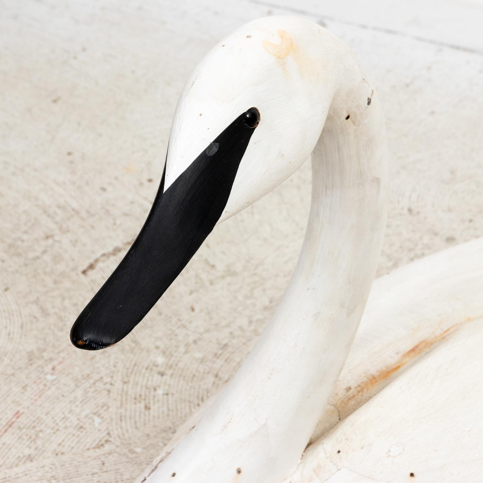 Life size carved and painted swan decoy by J.P. Hand. Made in the United States. Please note of wear consistent with age.