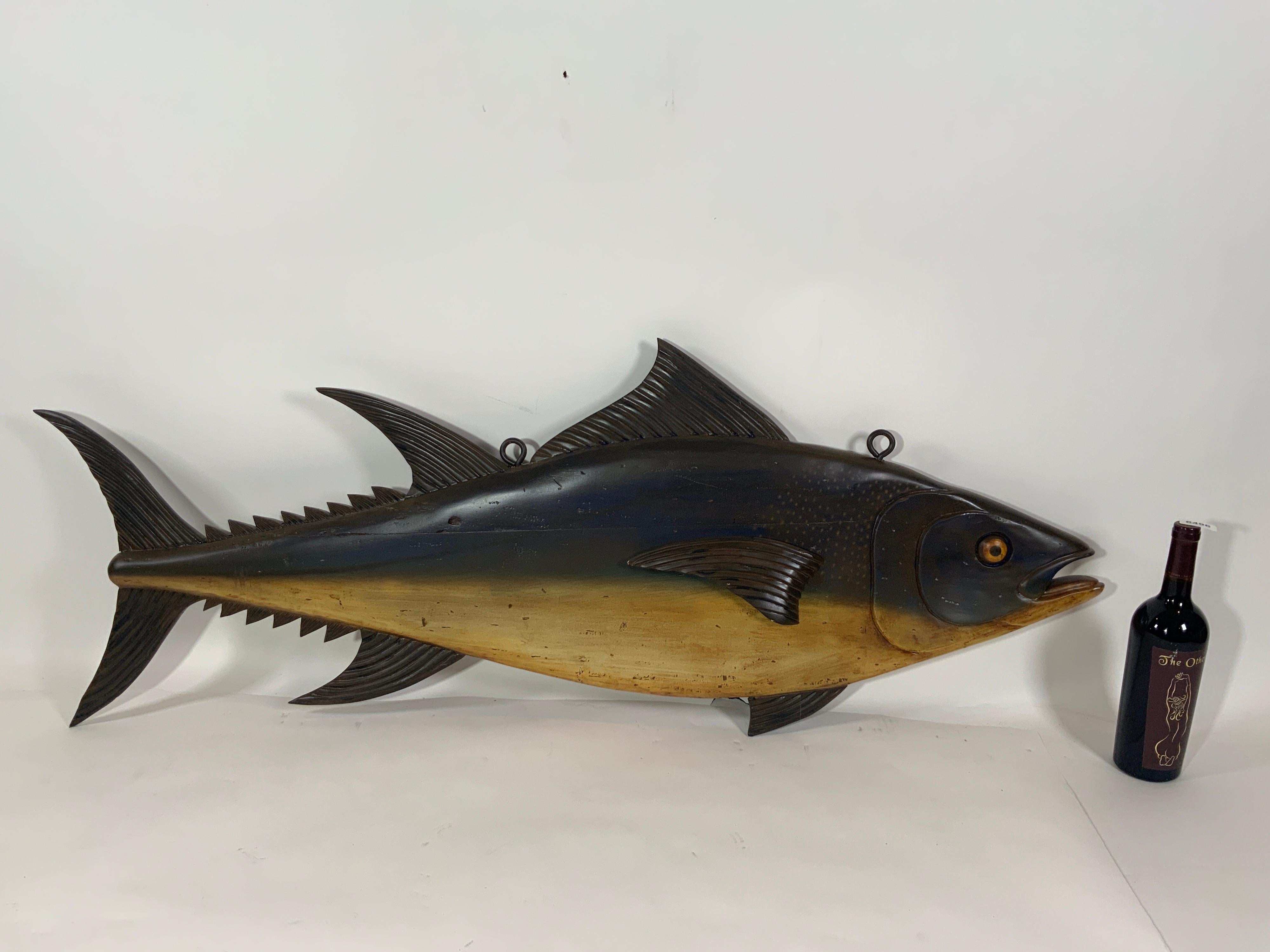 Expertly carved trade sign reminiscent of those that used to hand in the large waterfront fish piers in England. This tuna has been authentically painted, fitted with iron hanging bolts with rings.

Overall dimensions: Weight is 15 pounds. 20