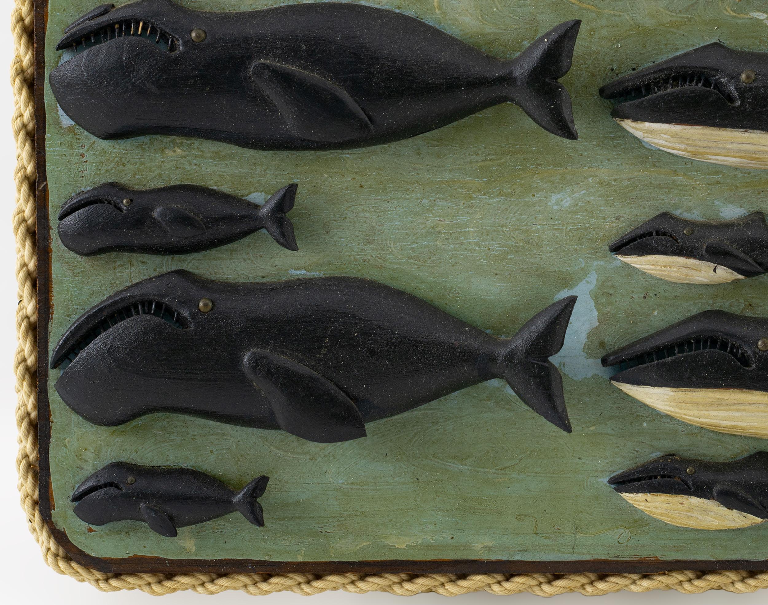 Featuring twelve carved whales mounted on a painted pine board with roped frame.
Signed on the back with description of whales carved.
George Grant (1857-1942), the son of whaling captain Charles Grant, was born in 1857 during a whaling voyage.