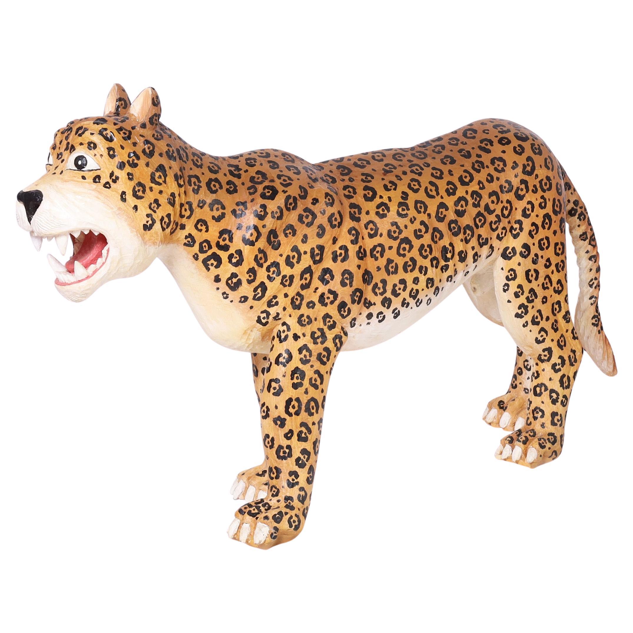 Standout whimsical vintage life size hand carved jaguar decorated with its distinctive rosettes in a faux fierce expression.