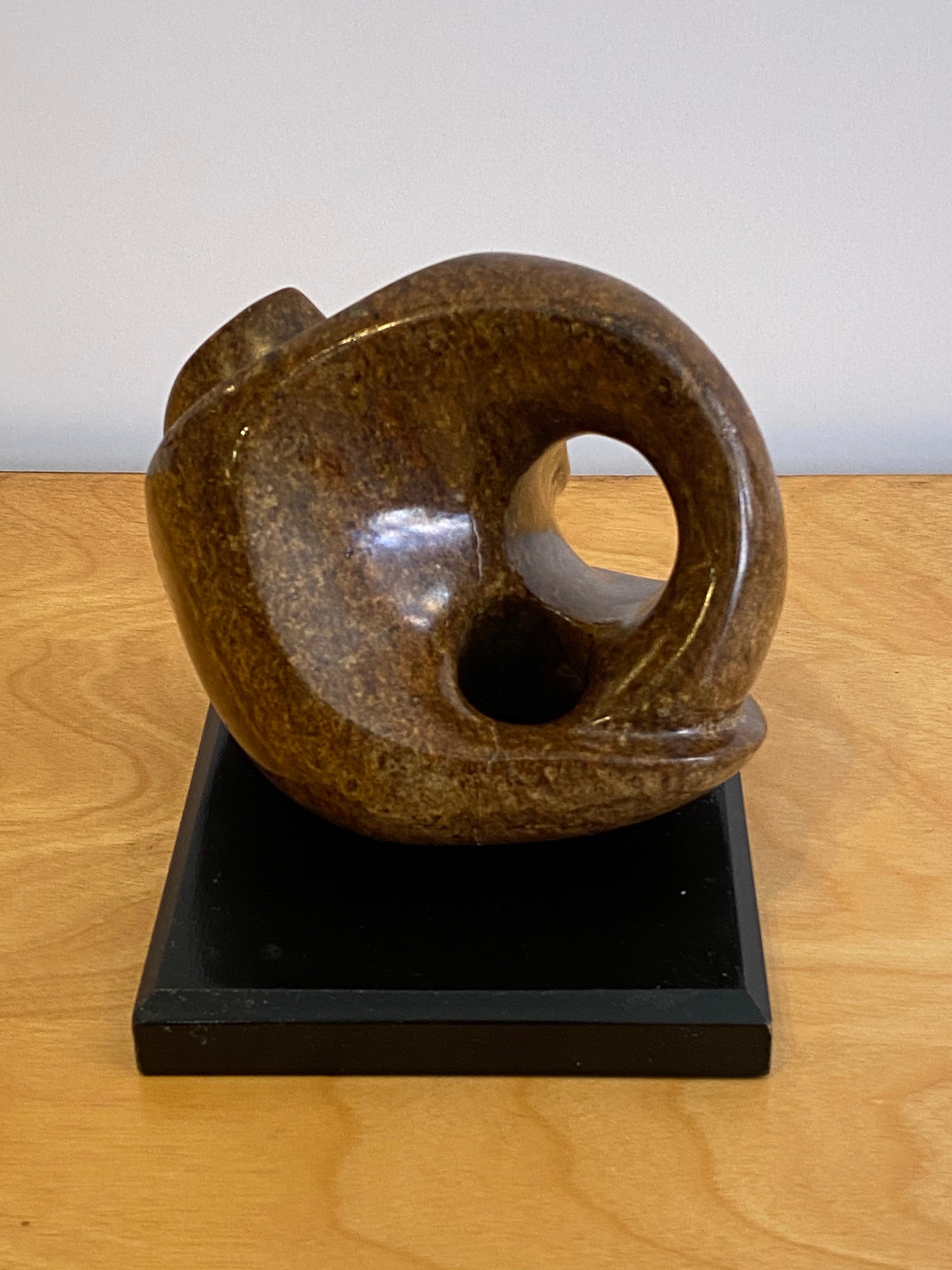 Brown marble carved and polished abstract sculpture on a wood base. Unsigned, very nice quality!