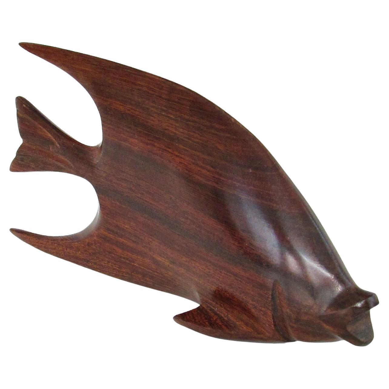 Carved and polished stylized rosewood desktop sculpture of fish