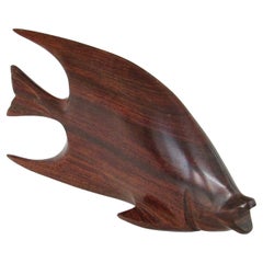 Carved and polished stylized rosewood desktop sculpture of fish