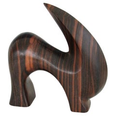 Carved and polished stylized rosewood desktop sculpture of ram or mountain goat