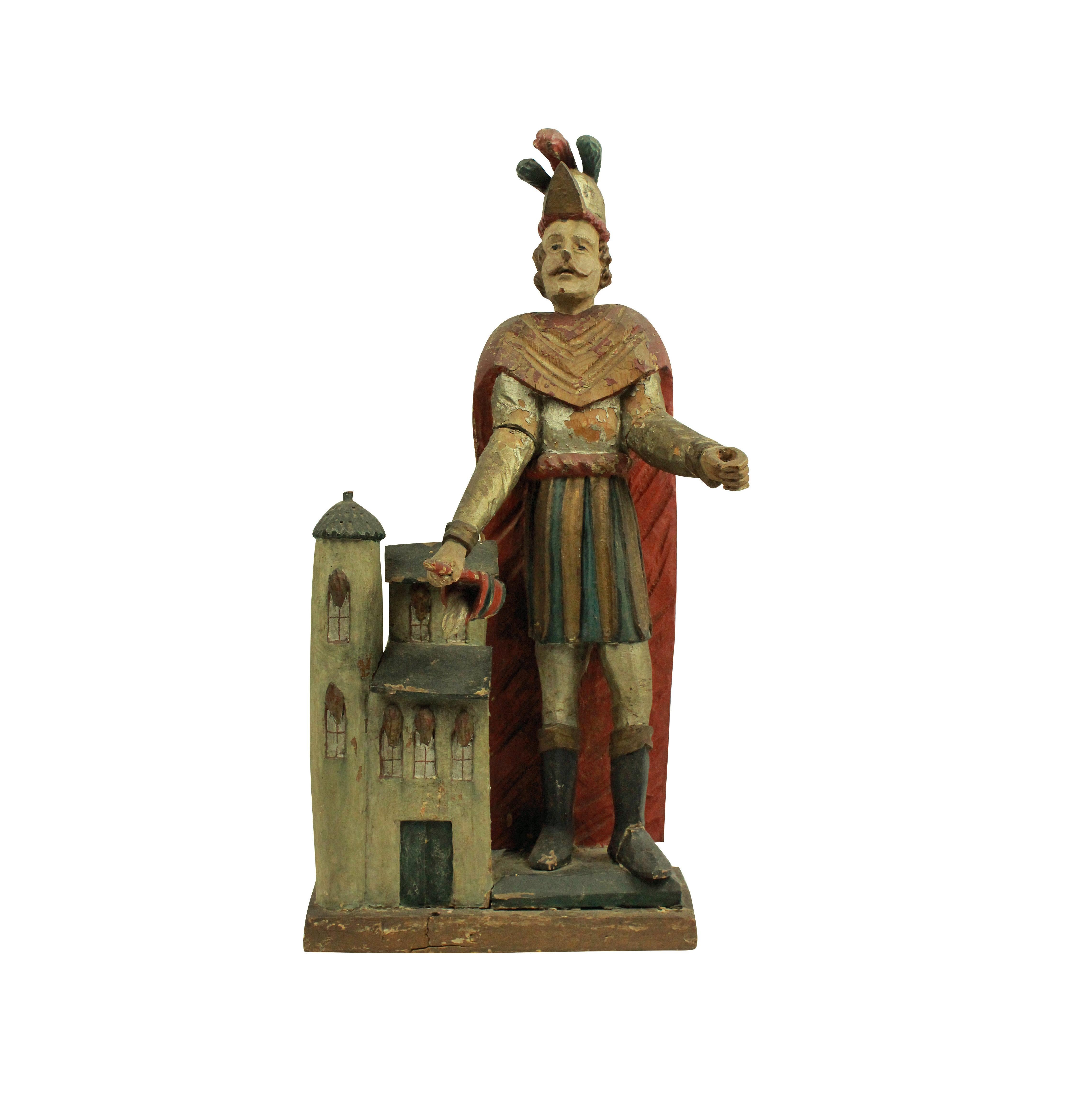 A French late 18th century statue of St Florian, in carved fruitwood with polychrome paints. Missing his spear.

The Patron Saint of Austria, chimney sweeps, fire fighters and brewers.