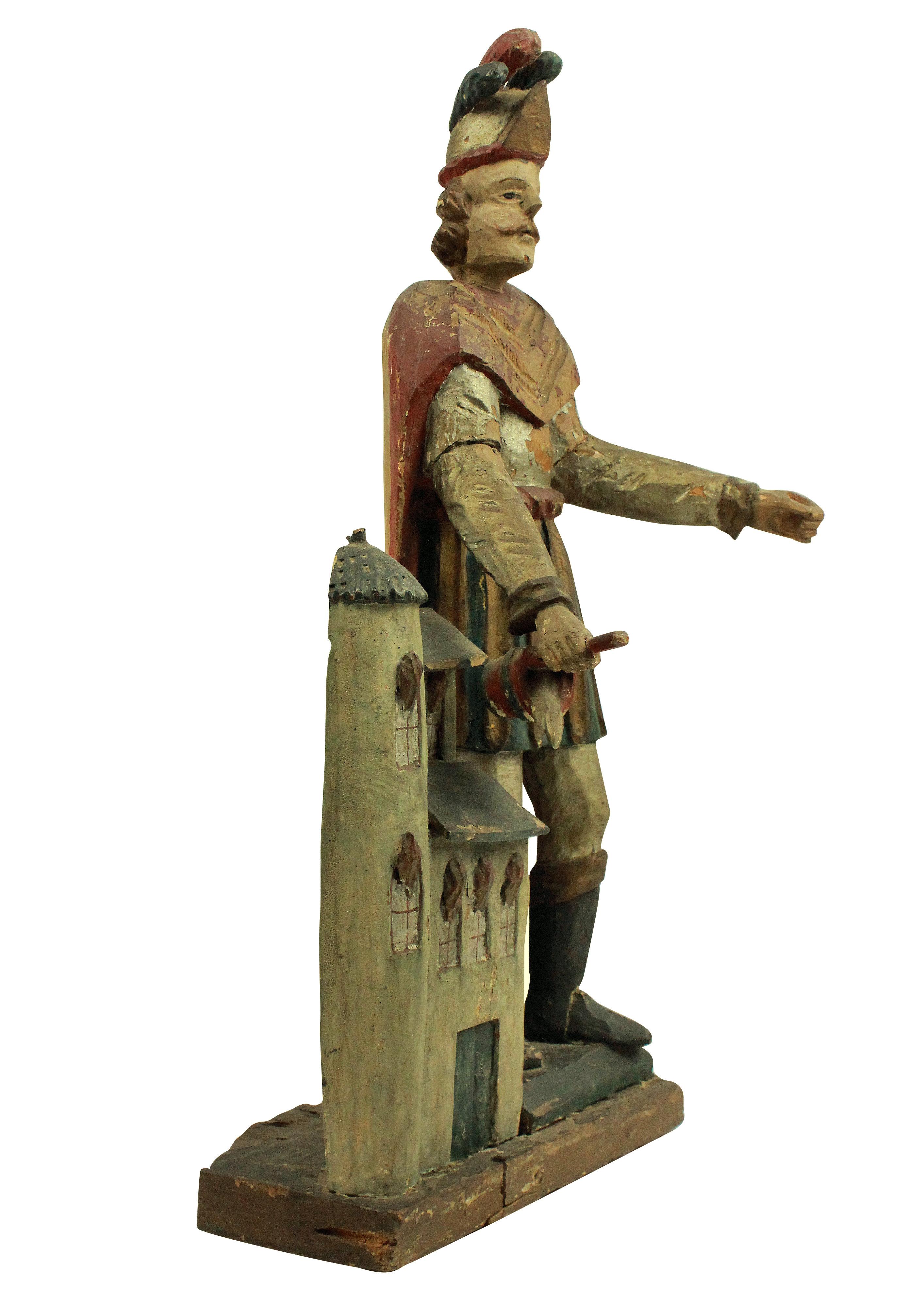 A French late 18th century statue of St Florian, in carved fruitwood with polychrome paints. Missing his spear.

The patron Saint of Austria, chimney sweeps, fire fighters and brewers.