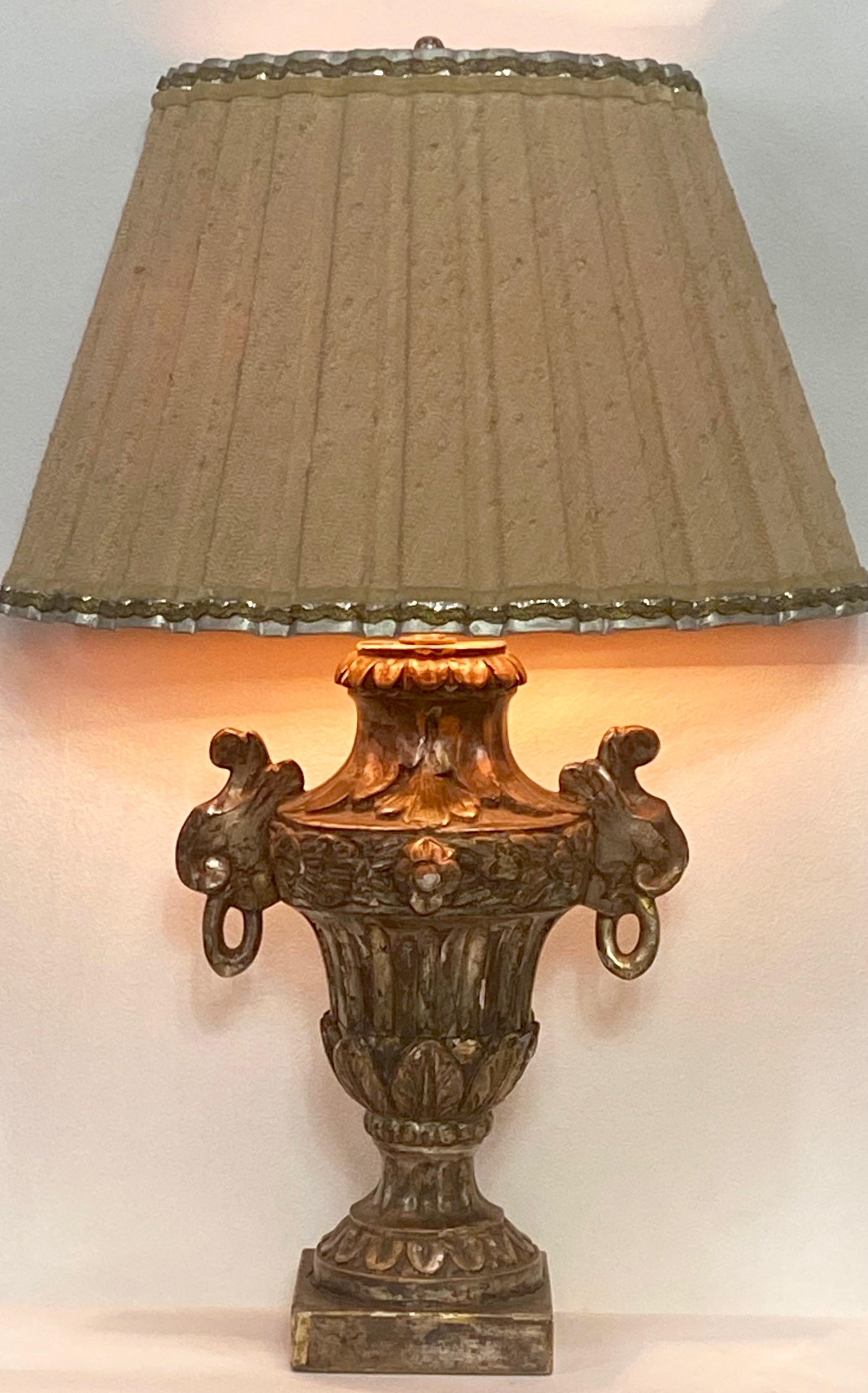 A 19th century Italian carved wood and silver gilt decorative half urn converted to a lamp with original custom made shade.
Newly rewired.

  
