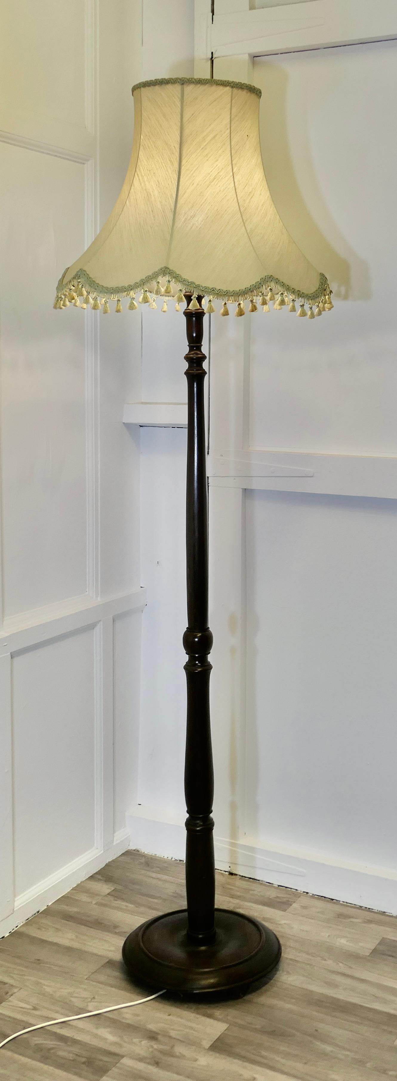 Carved and Turned Floor Lamp, Standard Lamp

This lamp stands on a turned wooden base and has a turned upright column, it is in good condition, the wiring is new, this is a very fine quality lamp
The lamp is 75” high and the base is 14” in diameter,
