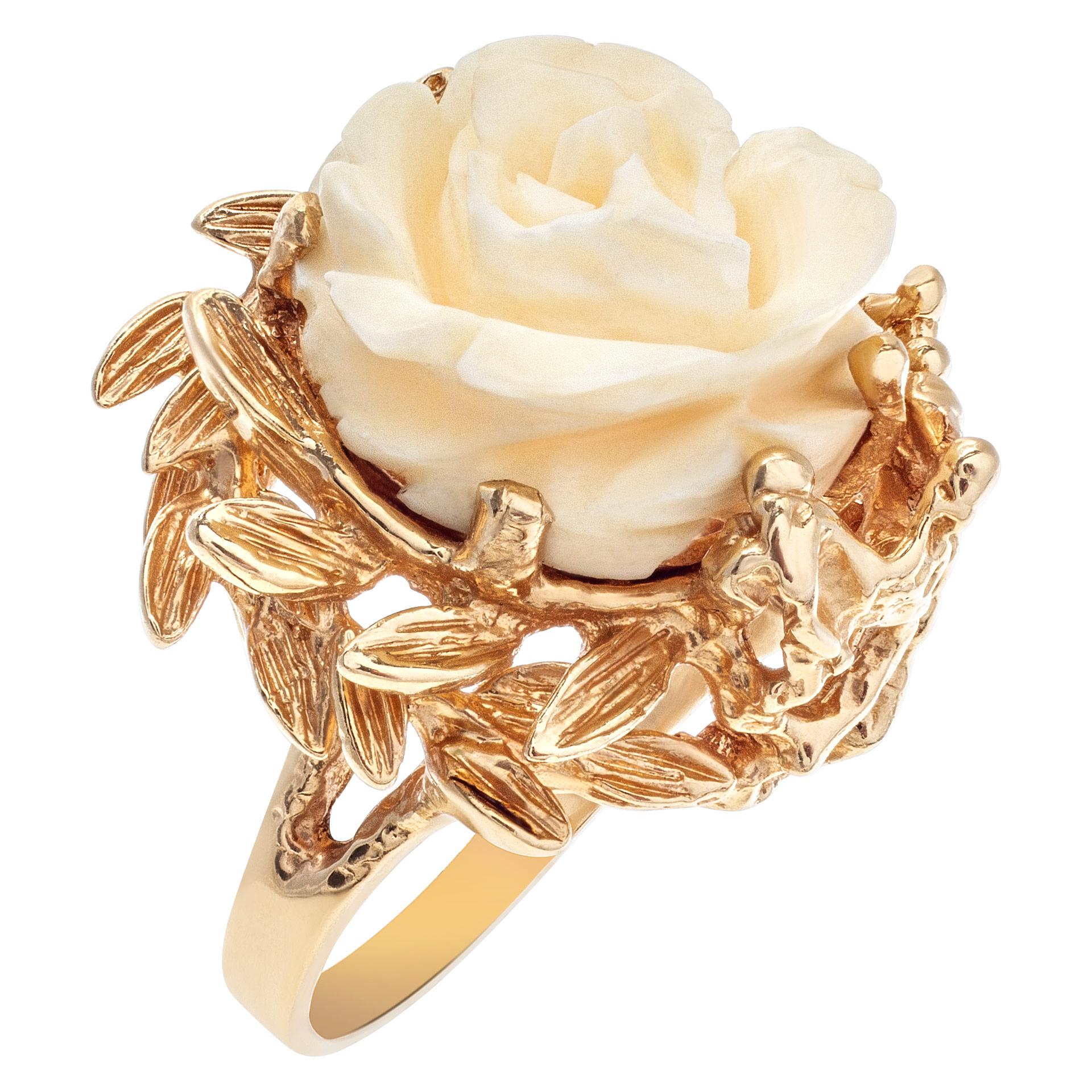 Beautifully carved angel skin coral rose motif ring in 14k yellow gold with accents of gold branches and leaves. Width at head: 21mm, width at shank: 2.5mm. Size 6.This ring is currently size 6 and some items can be sized up or down, please ask! It