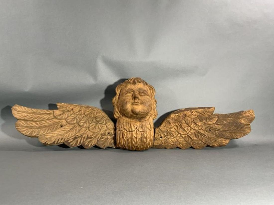 Carved angel trailboard with spread wings. Pierced with mountain holes.

Overall Dimensions: 48