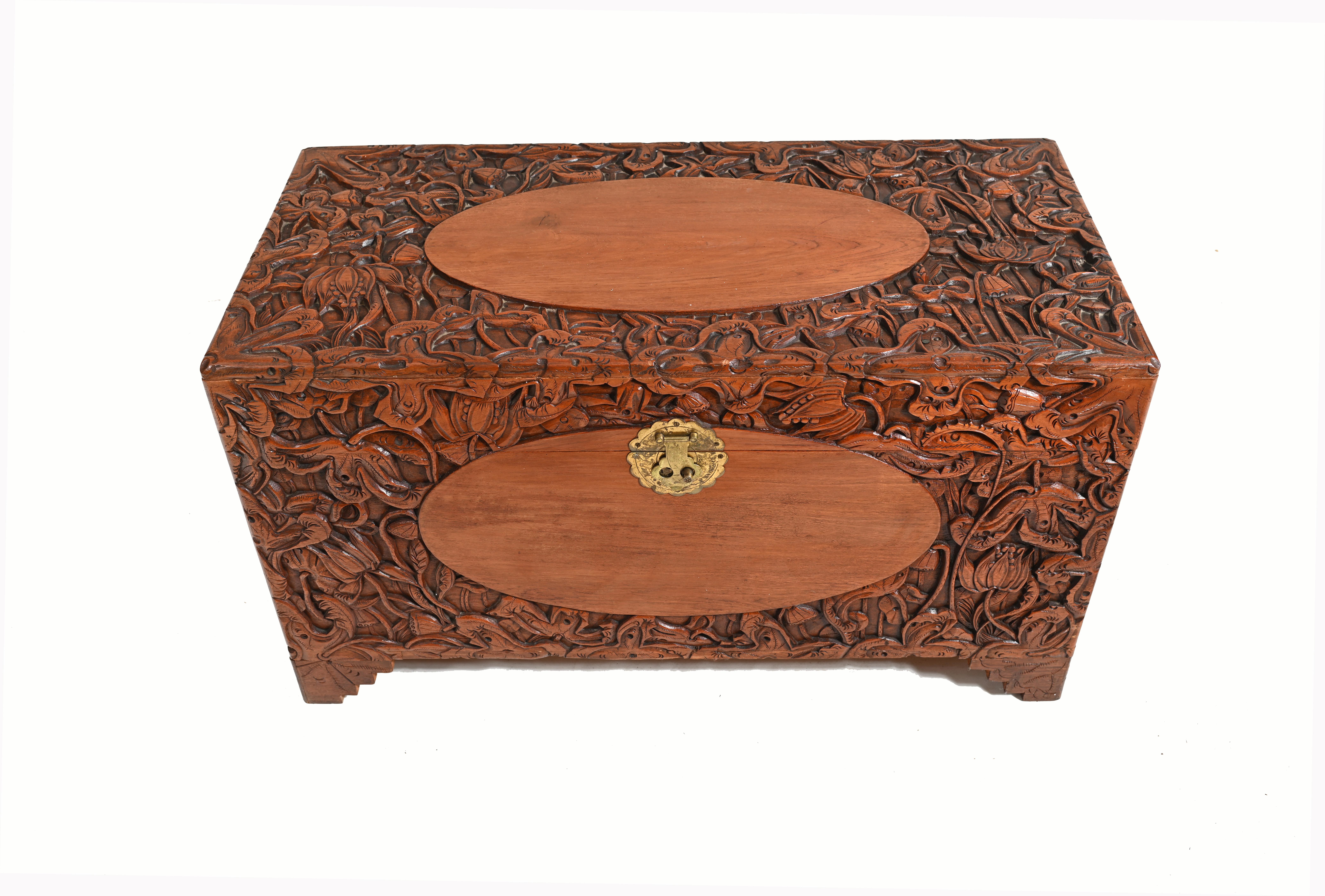 A heavily carved Chinese camphor wood chest, circa 1930.
Great interiors piece, can work as a side or coffee table.
Carving is amazingly intricate and profuse.

Offered in great shape ready for home use right away.