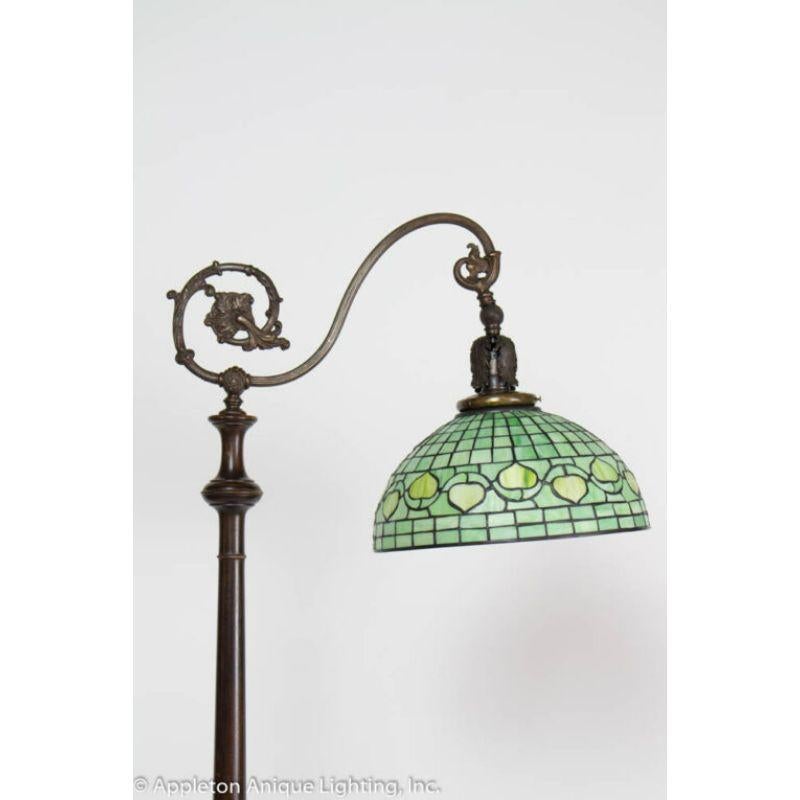 Carved Wooden Lamp with tripod base. Early electric. With Green Stained Glass Shade.

Material: Wood,Art Glass
Style: Traditional,Victorian
Place of Origin: United States
Period made: Late 19th Century
Dimensions: 19 × 19 × 64 in
Condition