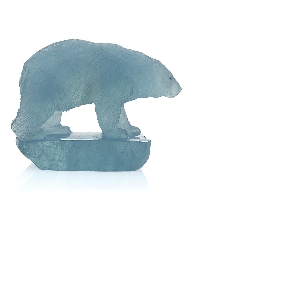 A carved aquamarine polar bear sculpture in miniature by famed gem carver Gerd Dreher. Gerd Dreher is a German from the Idar-Oberstein region. His family has been carving gems for five generations.   

The bear's coat has detailed textured carving.