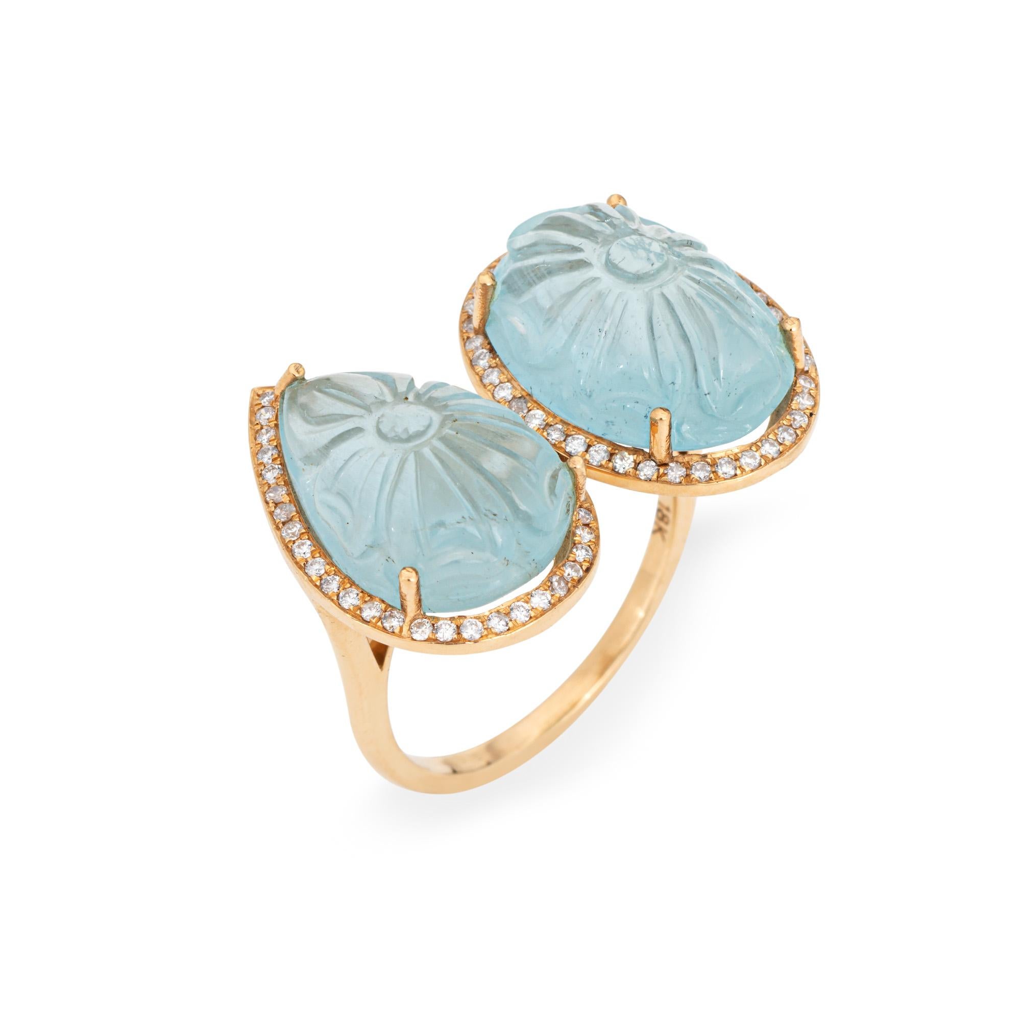 Stylish contemporary carved aquamarine & diamond cocktail ring crafted in 18k yellow gold. 

Carved aquamarines measure 15mm x 10.5mm. Diamonds total an estimated 0.38 carats (estimated at I-J color and SI1-I2 clarity). 

The light to medium blue