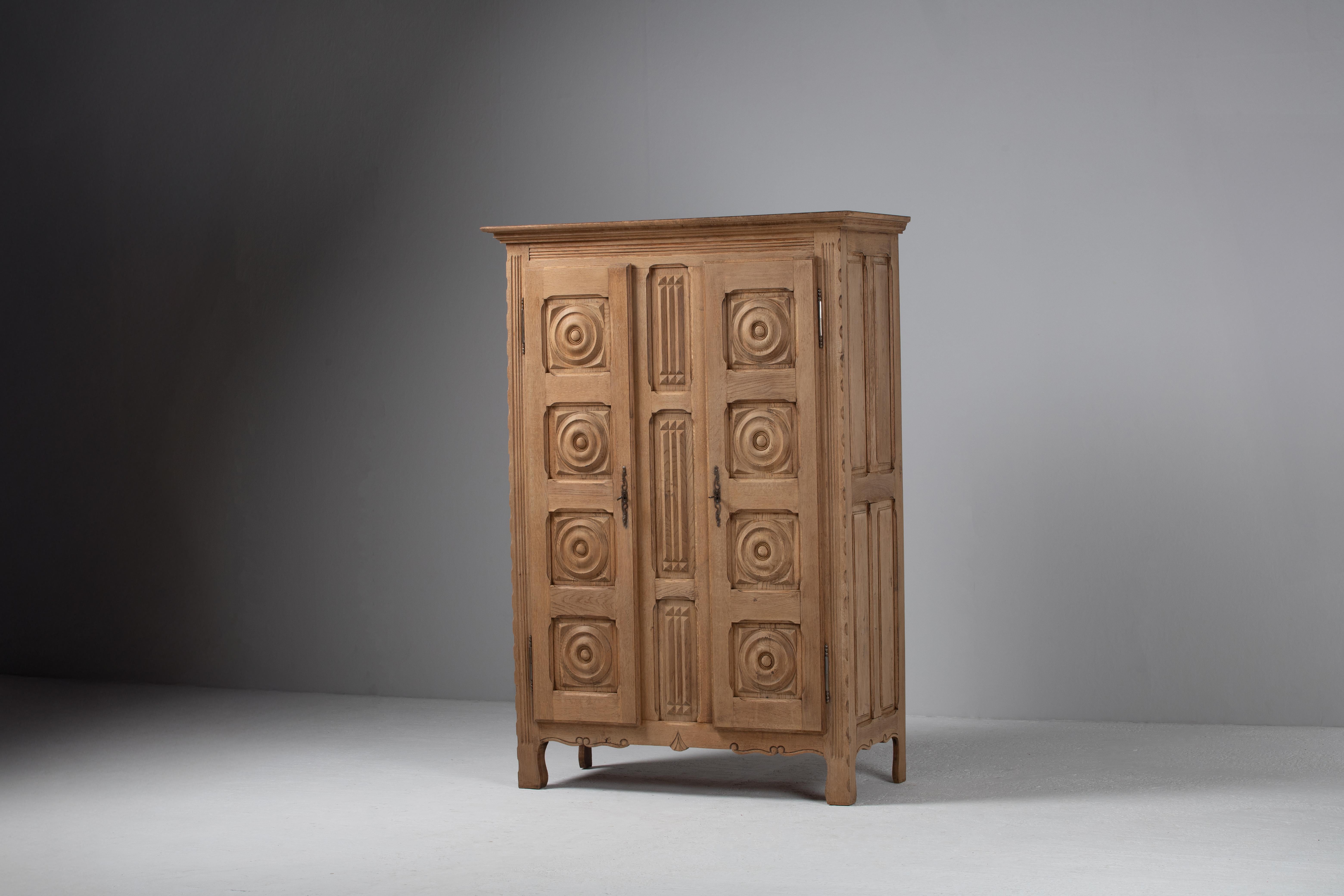 Carved Armoire in Bleached Oak, France, 1940s
A sculptural heirloom echoing the geometry of French provincial ritual forms

Monumental yet delicately resolved, this French armoire from the 1940s stands as a testament to the enduring artistry of