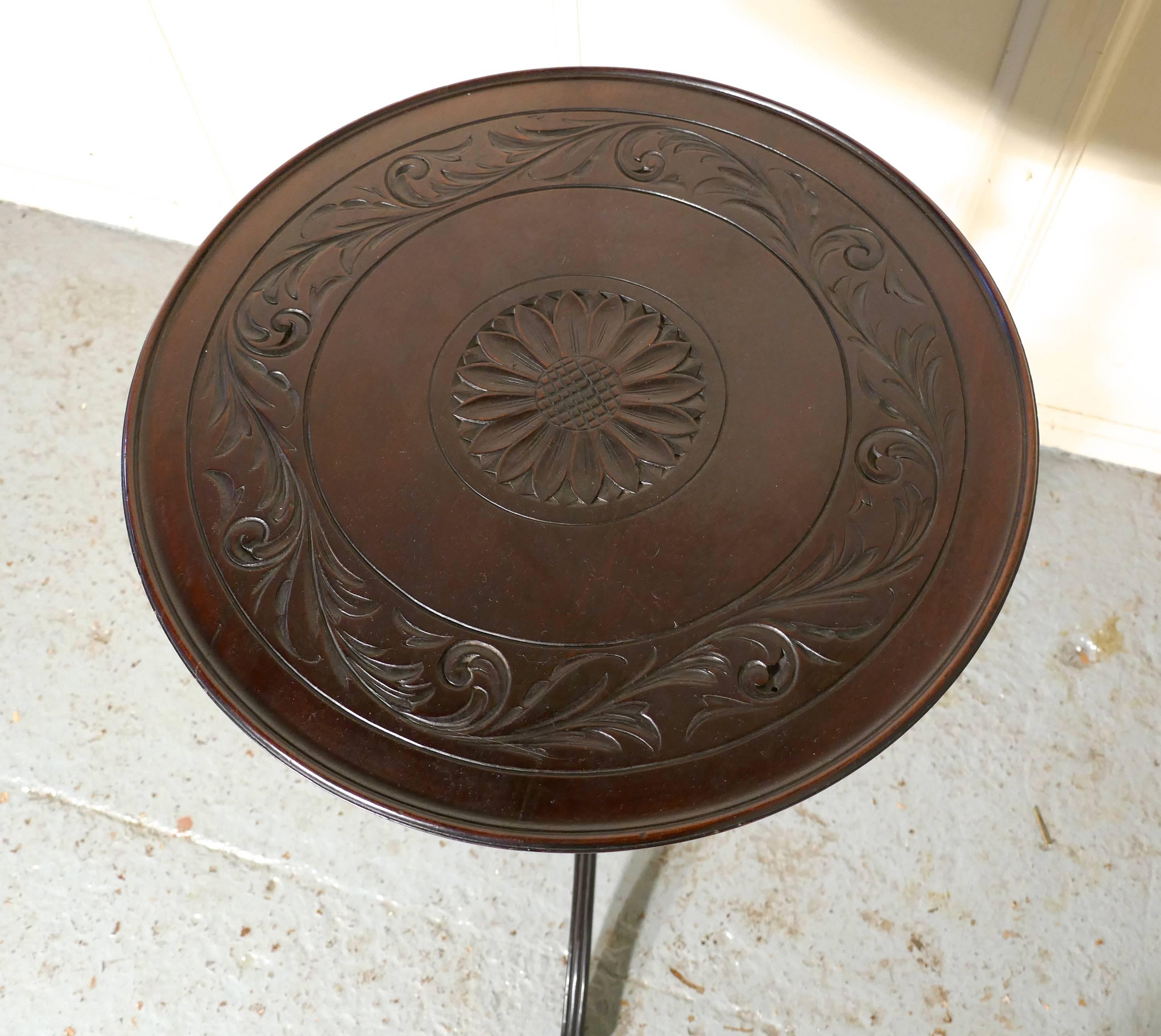 Carved Art Nouveau mahogany wine table by Bulstrode of Cambridge

This lovely and unusual table it stands on a very unusual three footed base, with has an exquisitely turned centre column with the reeded splayed legs scrolling out from quite a
