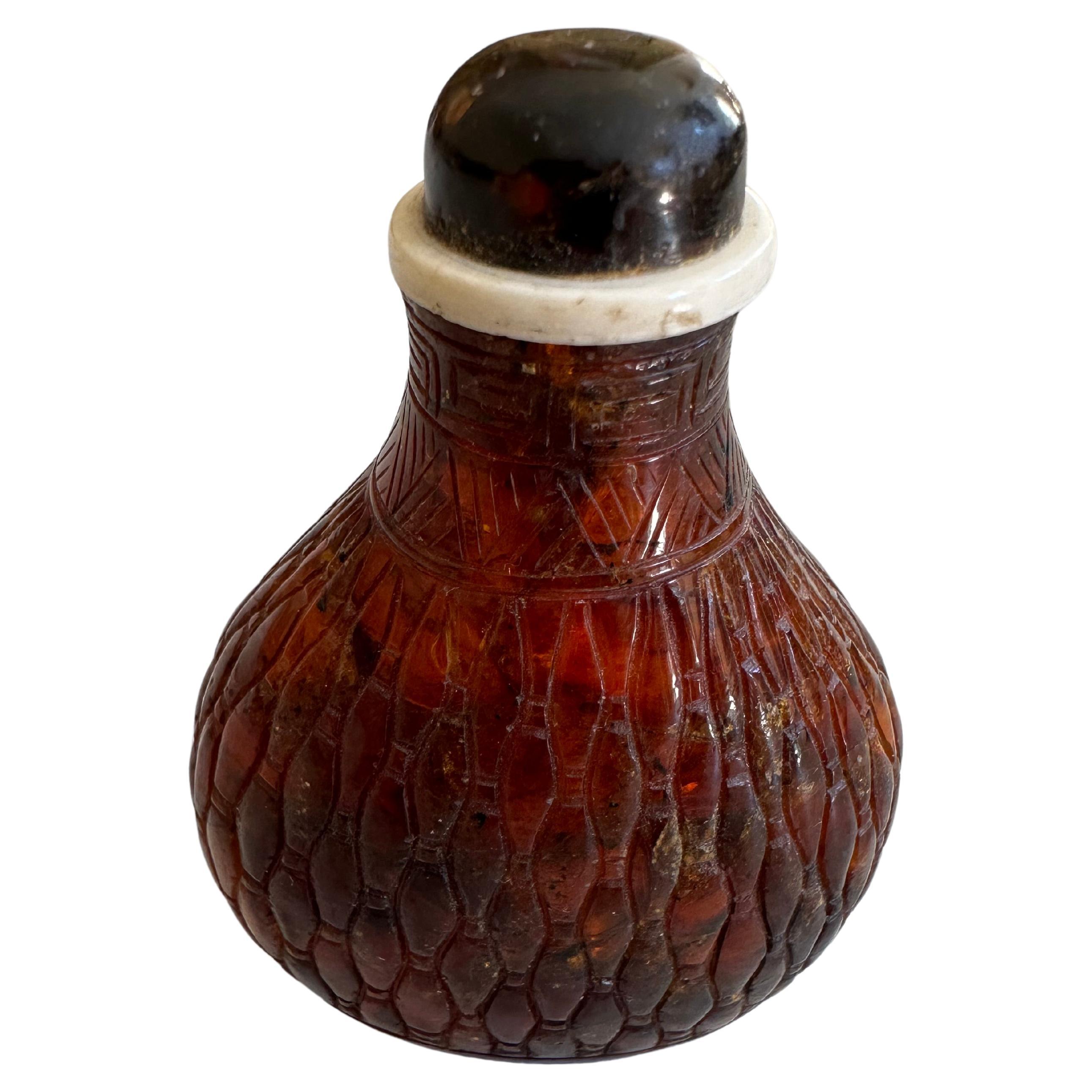 Carved Asian amber snuffbottle For Sale