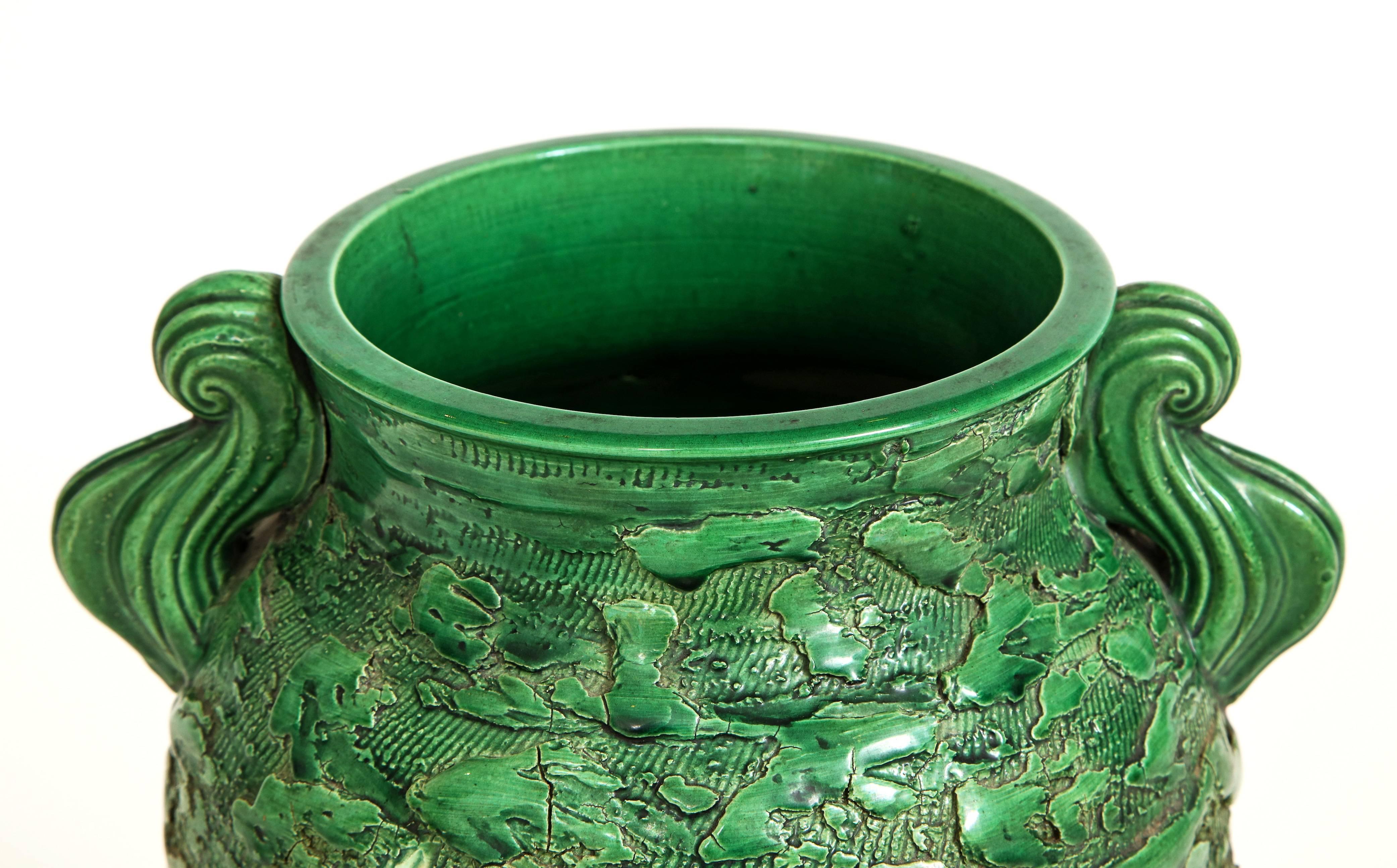 Stunning and large emerald green hand card ceramic Awaji vase with iris design. This dynamic vase shows the artistry of the Japanese during the 1920s. Magnificent scale and a vibrant mix of carved green with blue irises creates this majestic vase