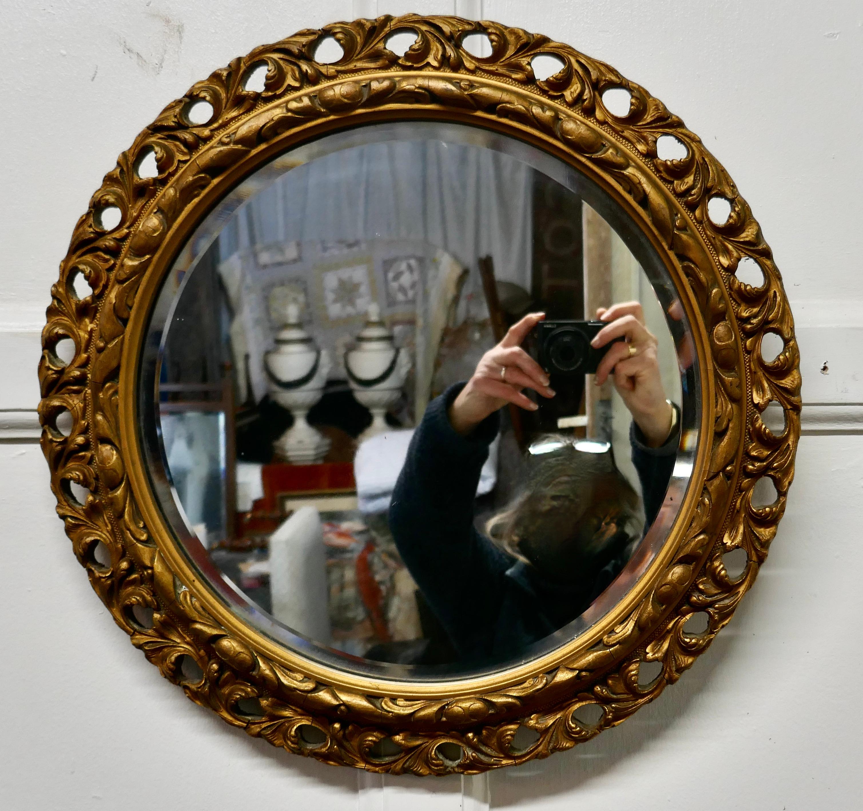 Carved bevelled gilt round wall mirror


This is a very attractive mirror has a 3” wide gilt frame which is carved and pierced and has a beveled looking glass 
The mirror is in good condition as is the original looking glass

The mirror is 18”