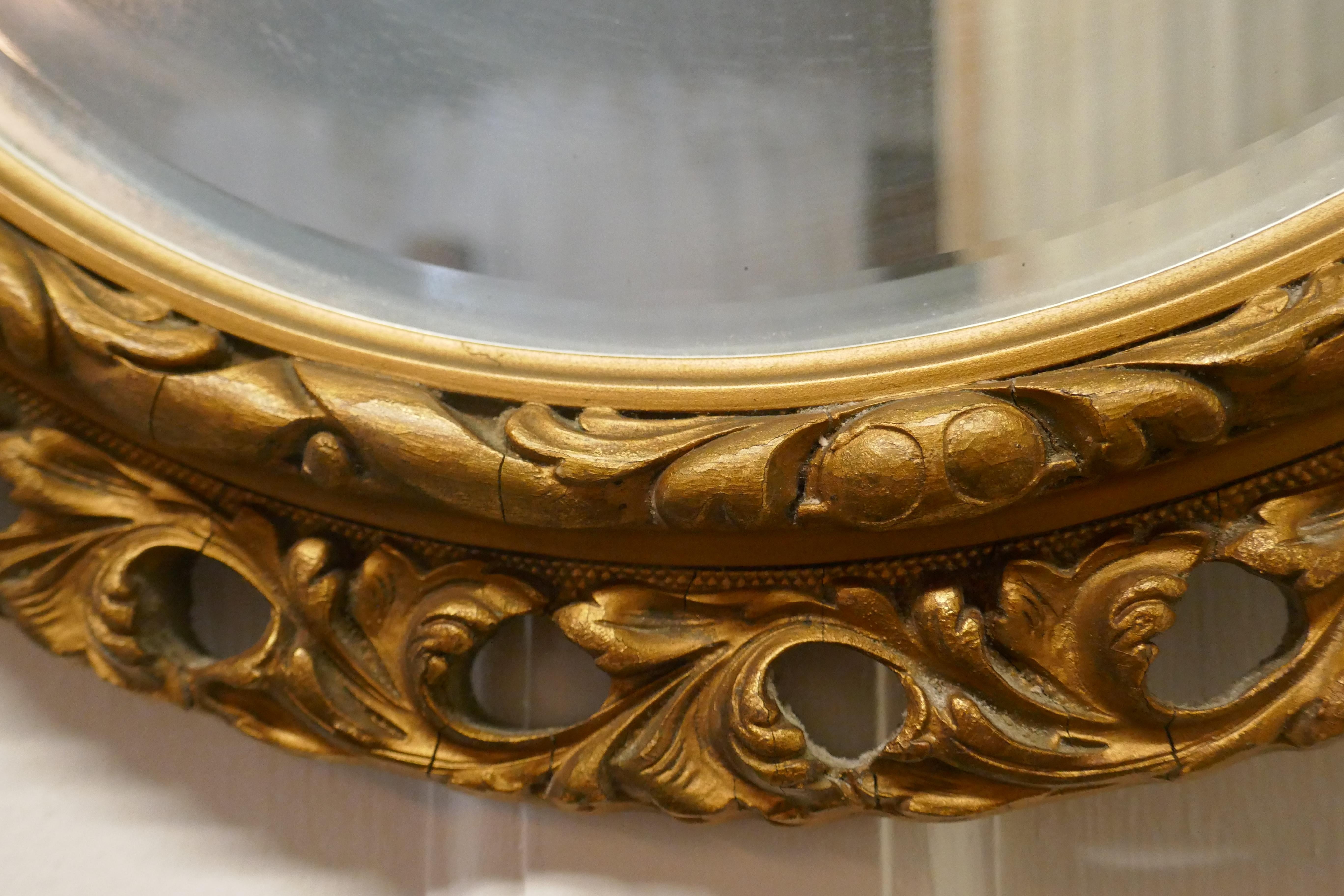 20th Century Carved Bevelled Gilt Round Wall Mirror For Sale
