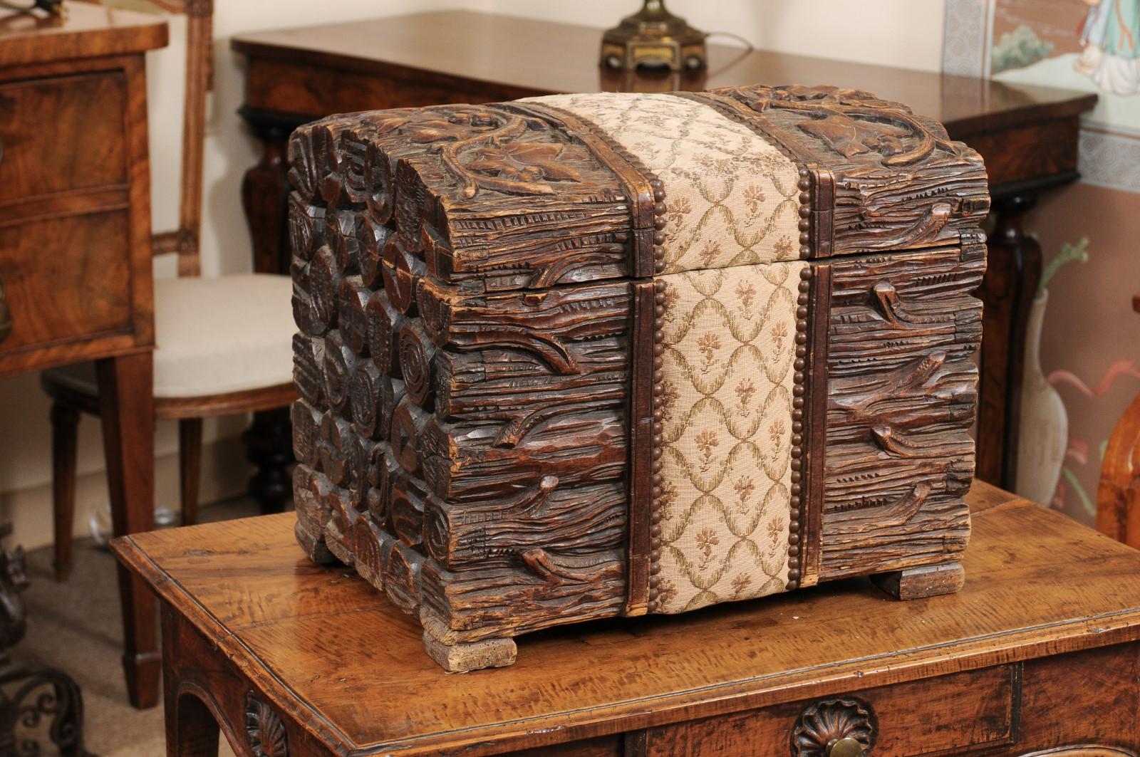 French Black Forest carved wood trunk with hinged lift top and grapevine motif, circa 1890.
