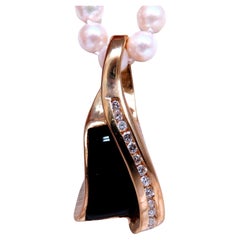 Collier en onyx noir sculpté et diamants naturels, or 14 carats*