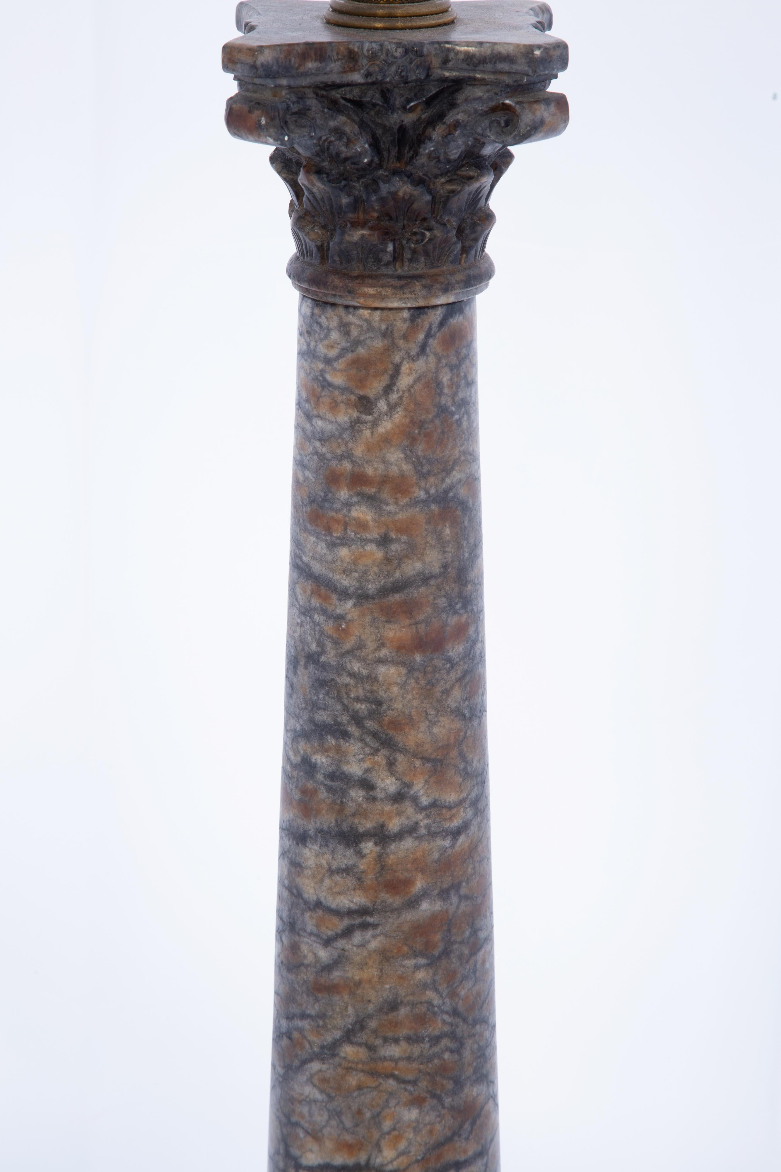 Columnar table lamp of rare Blue John marble having a carved Corinthian capital, on square plinth base.  

Stock ID: D4180