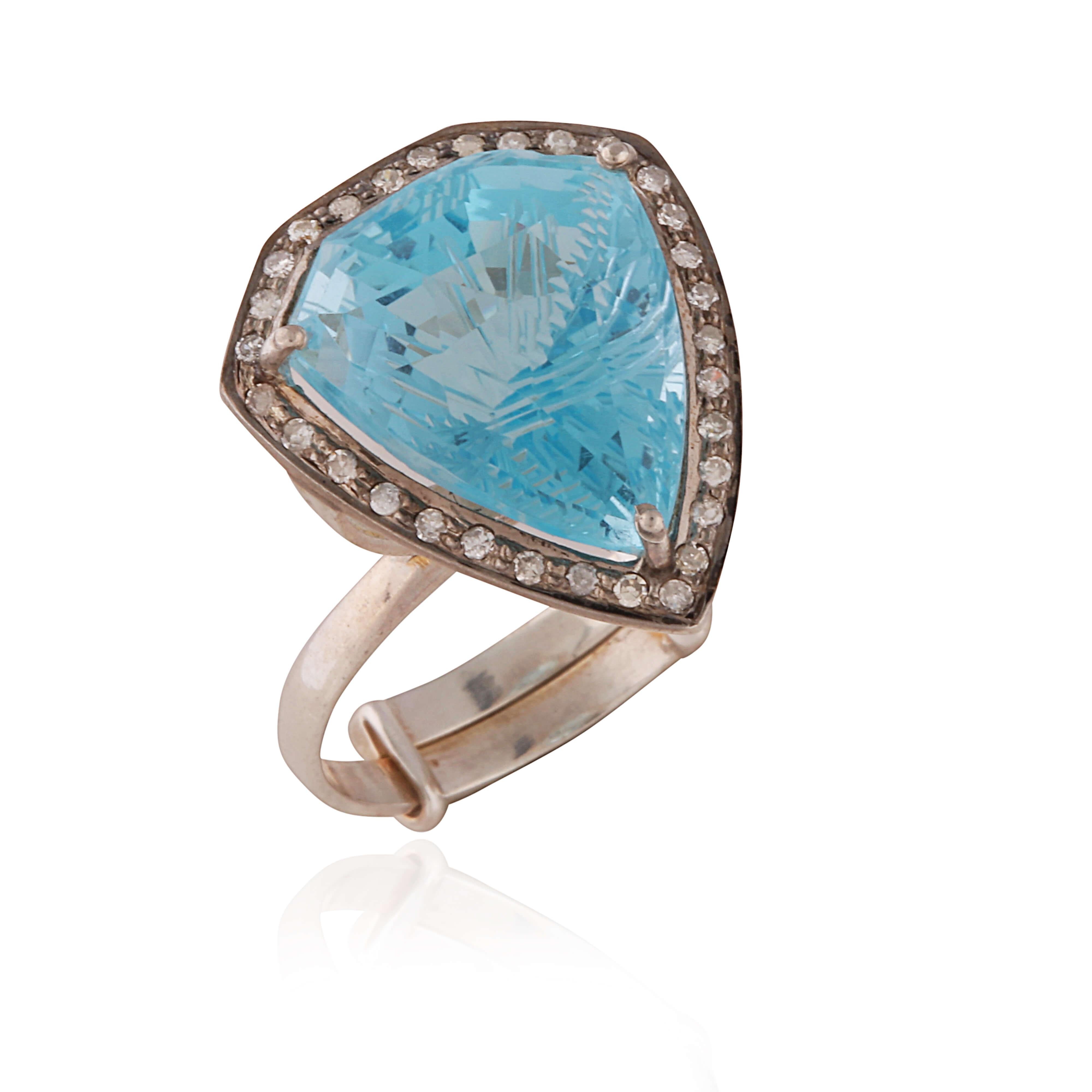 A really pretty ADJUSTABLE ring with a stunning carve Blue Topaz stone surrounded by a diamond border.

It is adjustable so can fit a range of finger sizes.

13.35 carat of carved blue topaz, 0.24 carat of diamonds.

Set on silver.

Comes with a