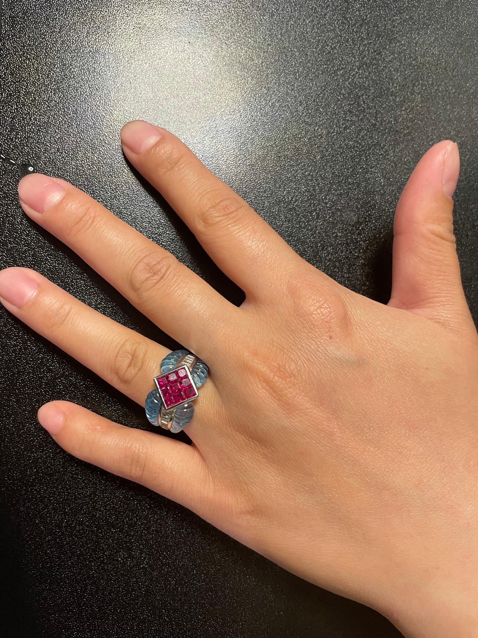 A Carved Blue Topaz Ring with 1.40 carats Ruby set with 0.46 cts. Diamond, made in 18 Karat White Gold. The weight of the ring is 13.66 grams. The Ring Size is US 6.50. 