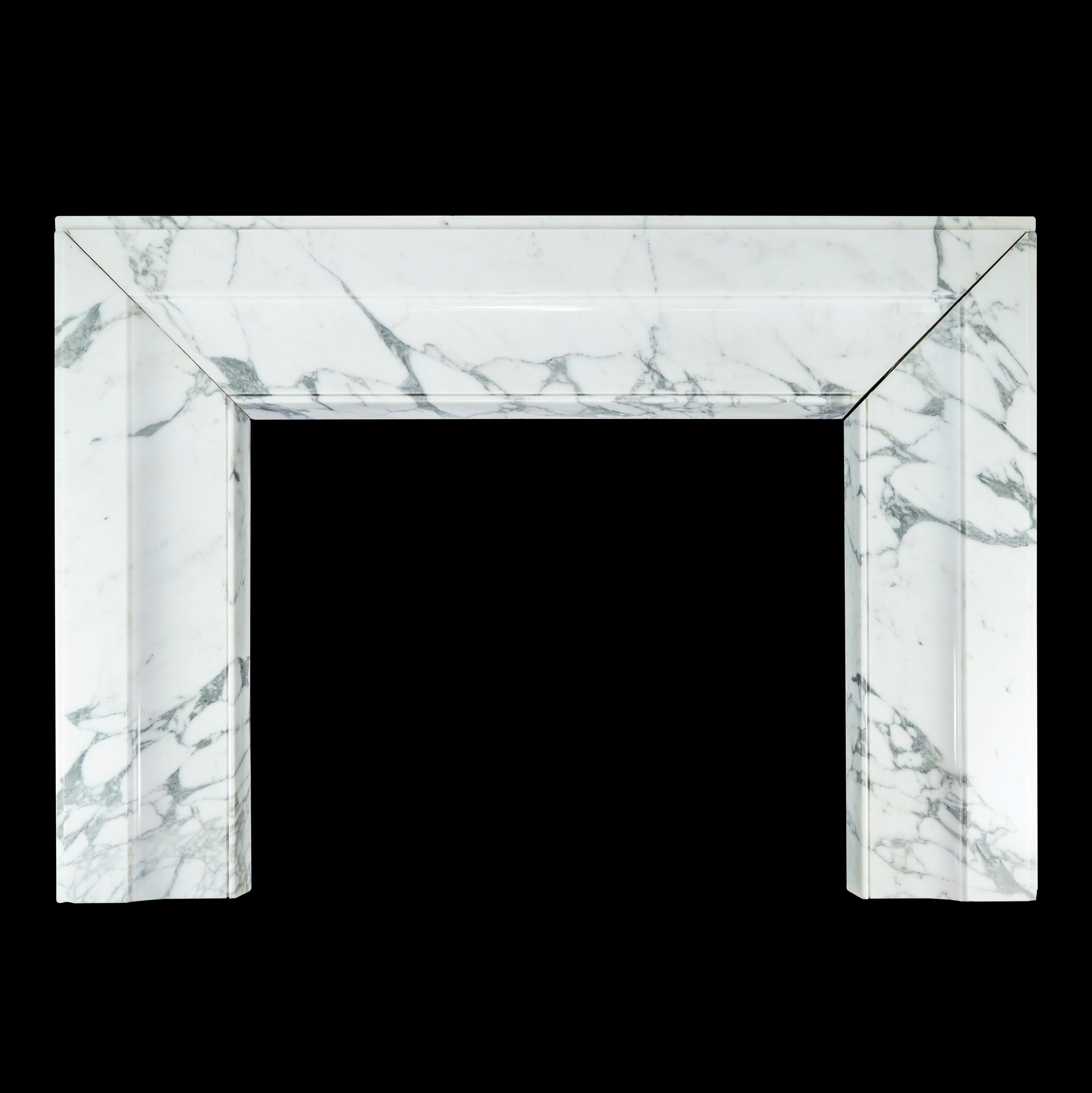 This 20th century Bolection style influenced fireplace mantel consists of three solid blocks of gray veined white marble. Features gentle curves and simple lines. The top of the surround is six inches deep and is a flat surface that can therefore