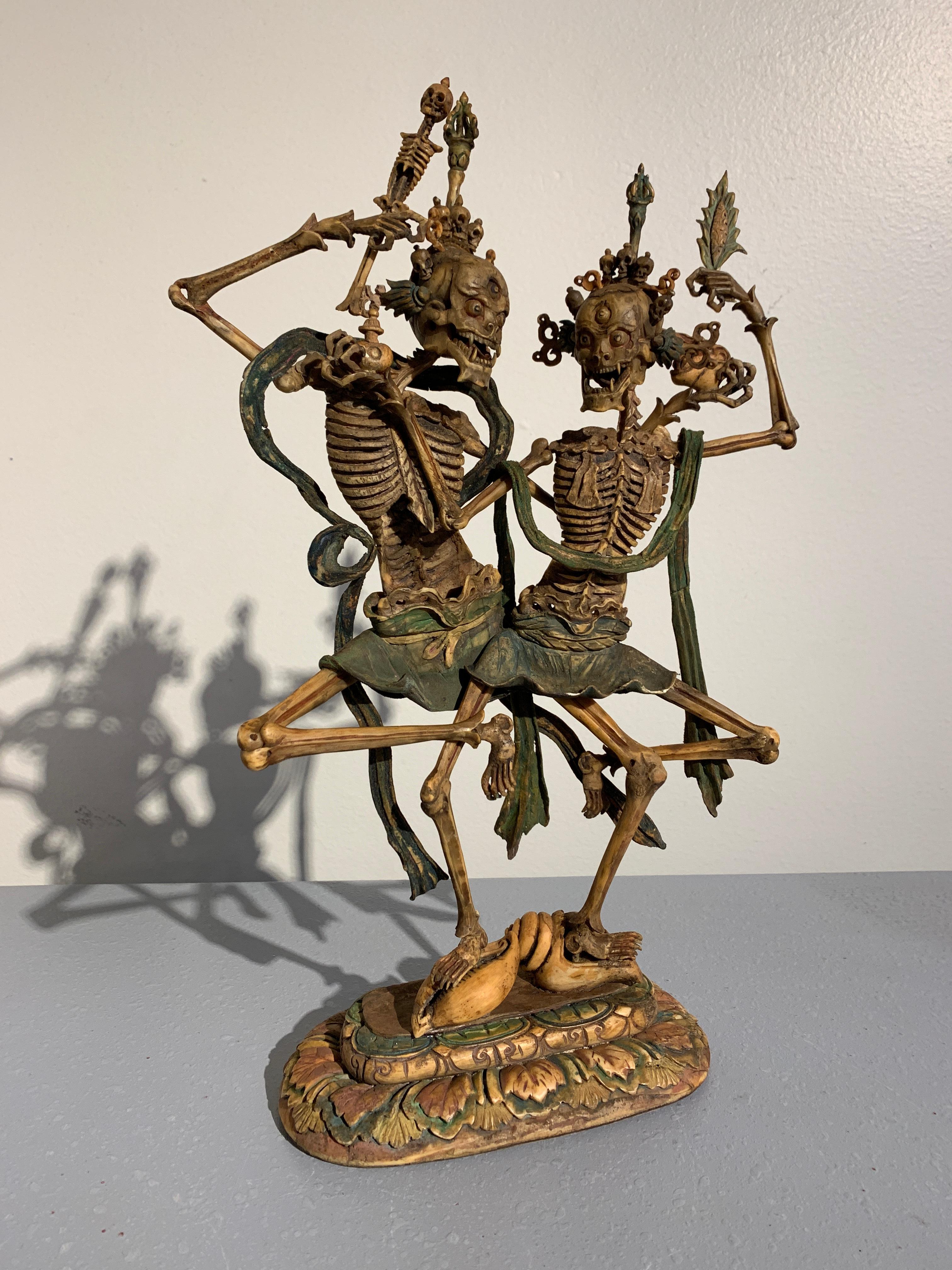 A magnificent polychrome carved bone and wood figure of Chitipati, Shri Shmashana Adhipati, the Glorious Lords of the Charnel Grounds, Mother and Father, Mongolia, 18th century.

Carved from bone, the two skeletal figures are portrayed intertwined