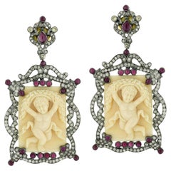 Carved Bone Dangle Earrings With Rubies and Diamonds 65.6 Carats