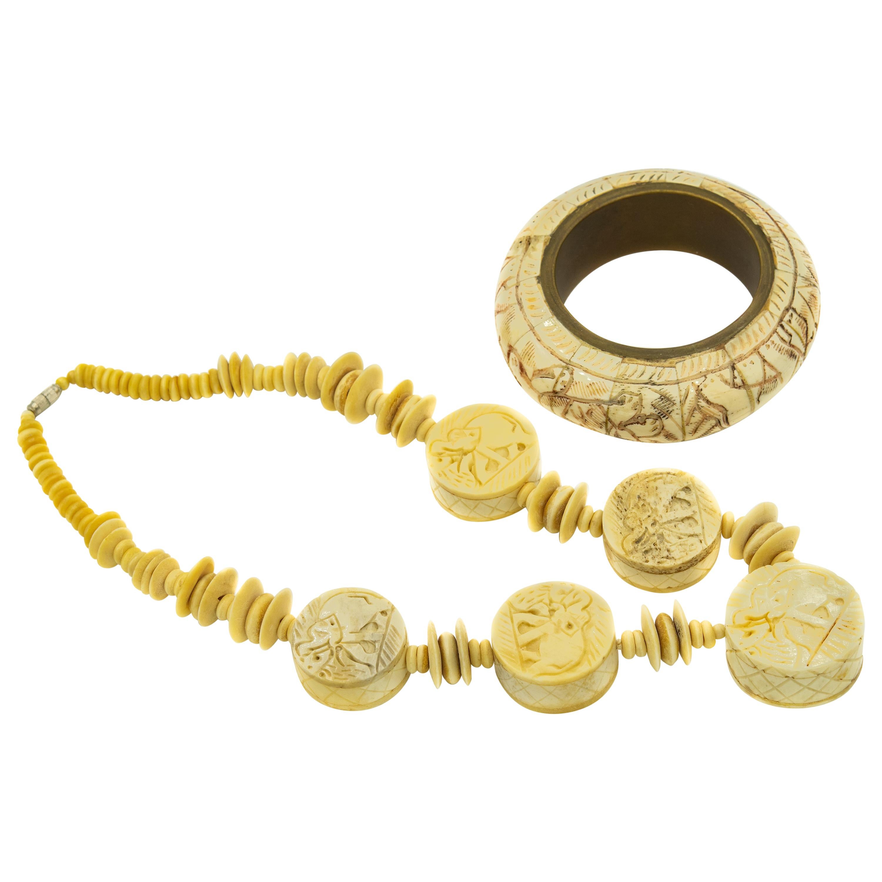 Carved Bone Elephant Necklace and Elephant and Lion Bone Bangle Bracelet Set For Sale